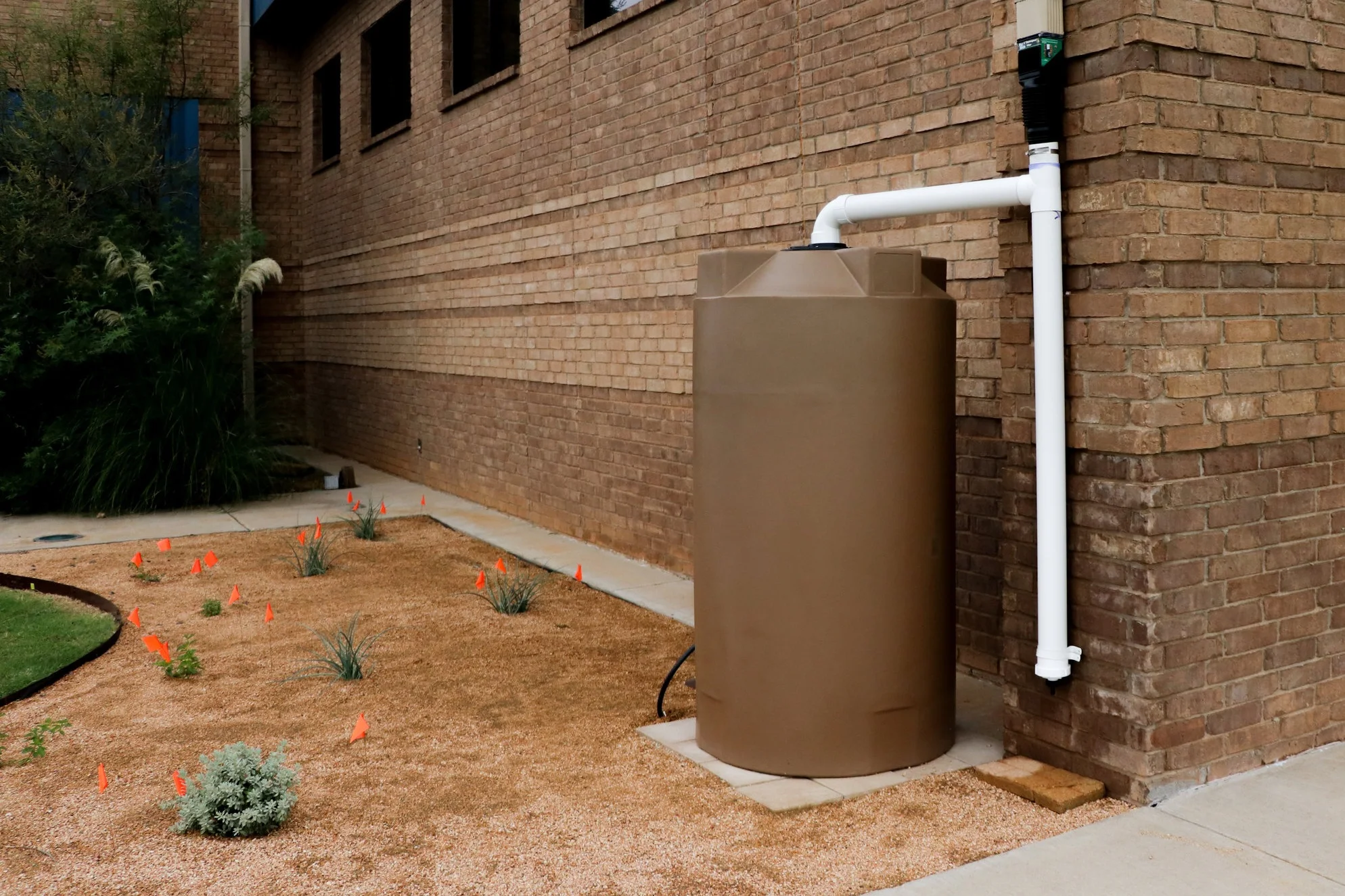 INORGANIC MULCH&nbsp;(granite) covers the landscape next to the rainwater harvesting system at the City of Wolfforth Public Library.