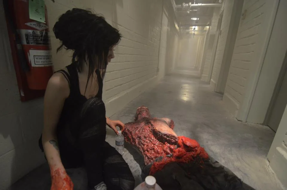 Laney Chantal touches up a prop from Dapper Cadaver