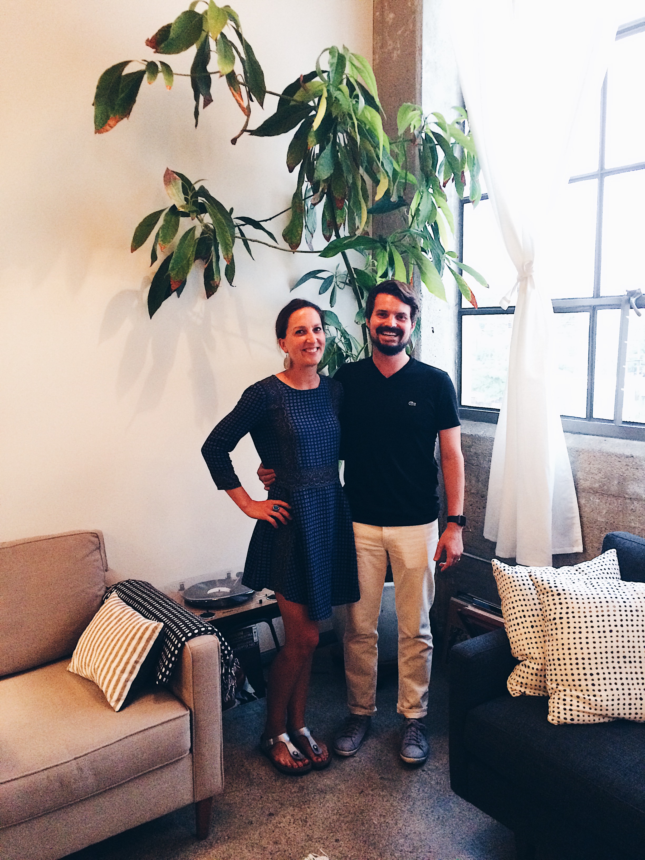 Crista and Liam in front of the avocado tree that they grew from a sprouted pit 11 years ago when they first started dating.