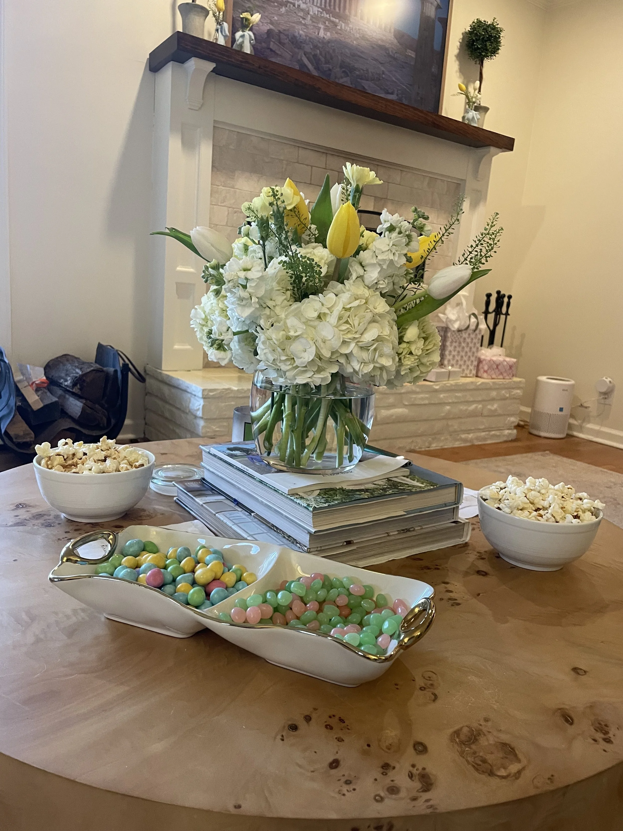 Simple snacks and seasonal blooms utilizing serveware as well as everyday dishes.
