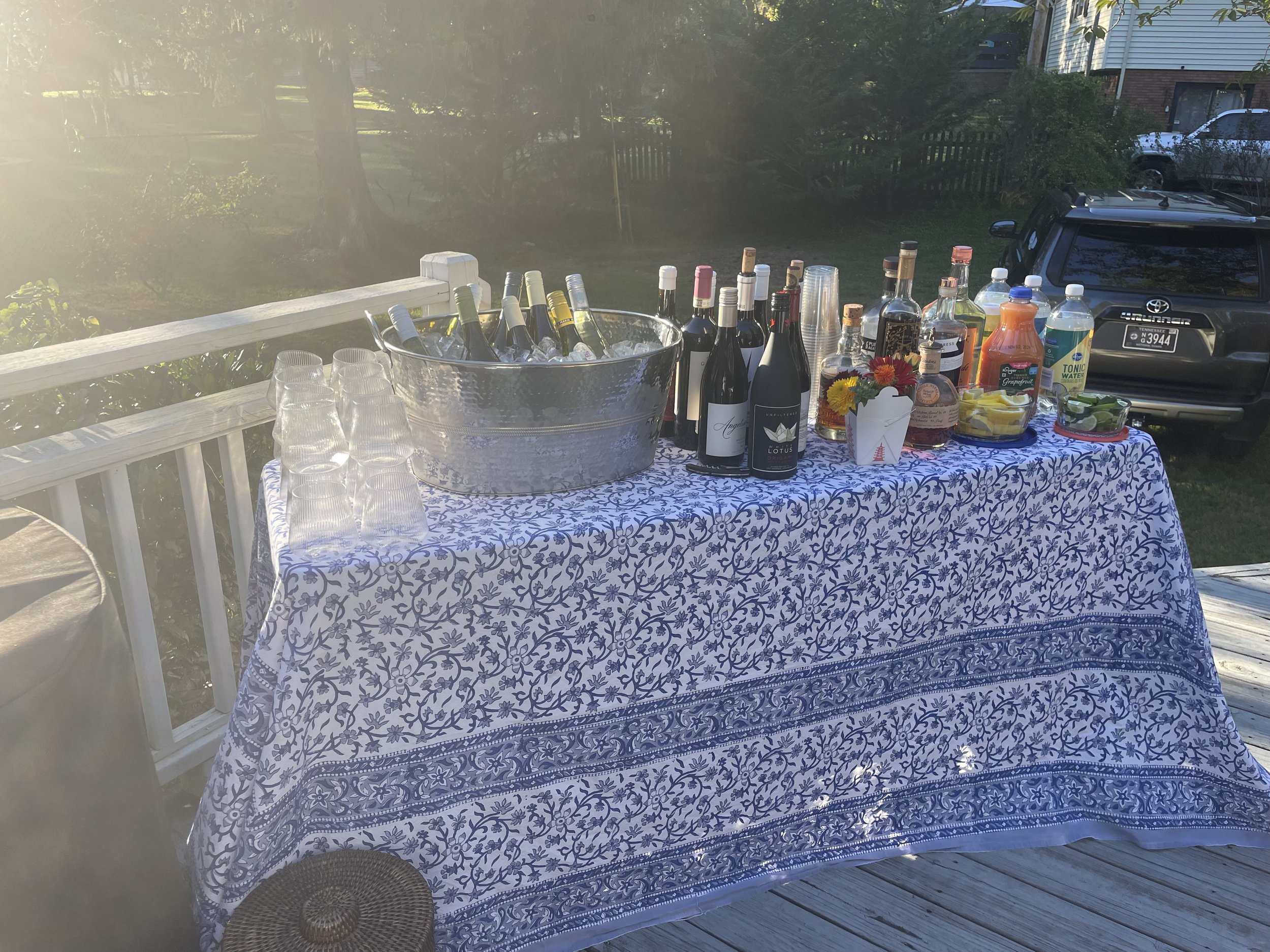 A versatile table cloth sets the scene for a serve yourself outdoor bar set up.