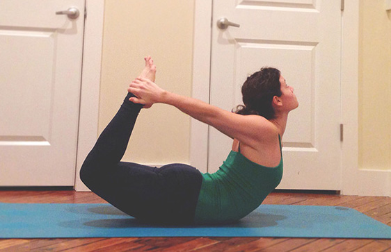 I'm giving you two options here because everyone's body is different and may not feel good in one or the other. Yoga should make you feel good, so don't push yourself if you feel any pain at all. On the other hand, if you're feeling flexy and strong, go ahead and try both! First up is Bow Pose. -Lay down on your mat, feet and legs together and arms out in front of you. -Reach your arms back, bend your knees and grab your ankles, gaze is slightly in front of your mat on the ground. -On an inhale, kick your feet into your hands lifting your chest and knees off the ground, and your gaze in between your eyebrows. -Keep breathing here, don't hold your breath, and stay here for 5.