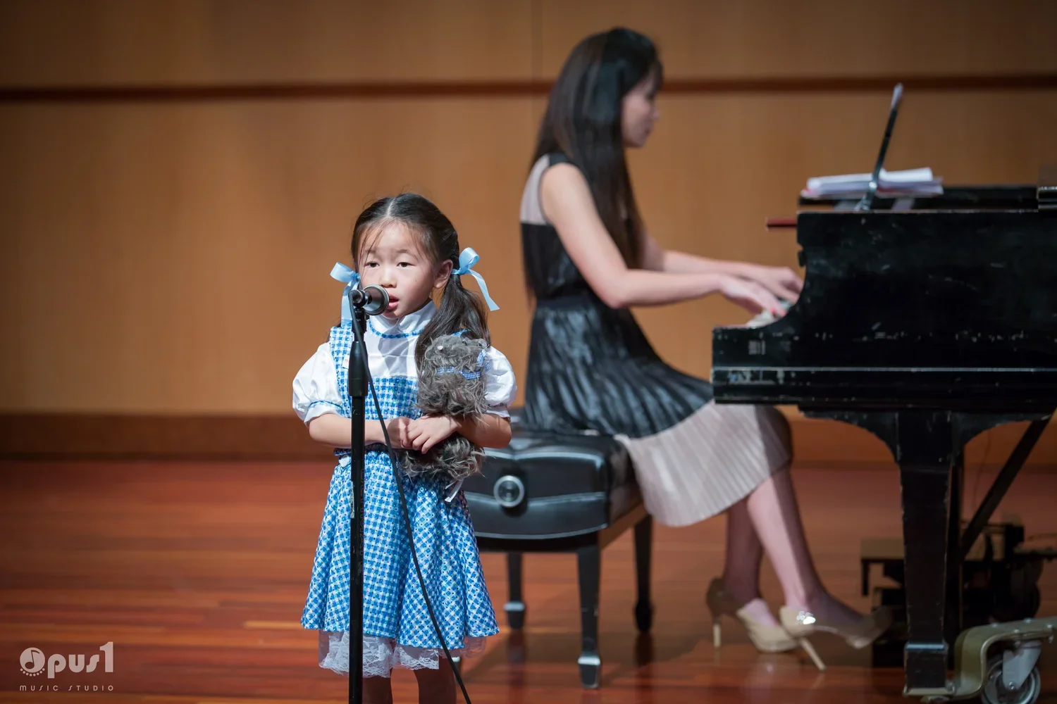 voice student at opus 1 music studio recital.webp
