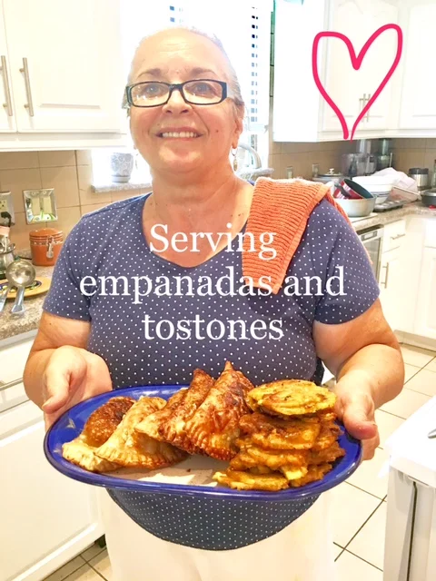 Serving the empanadas and the tostones.jpg