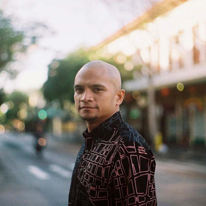  Kuha'o Zane  Creative Director of Sig Zane Designs and SZKaiao comes from an generational Hula family and practice that grounds and informs his day to day career as a designer. Zane, who studied graphic design at the Fashion Institute of Design and