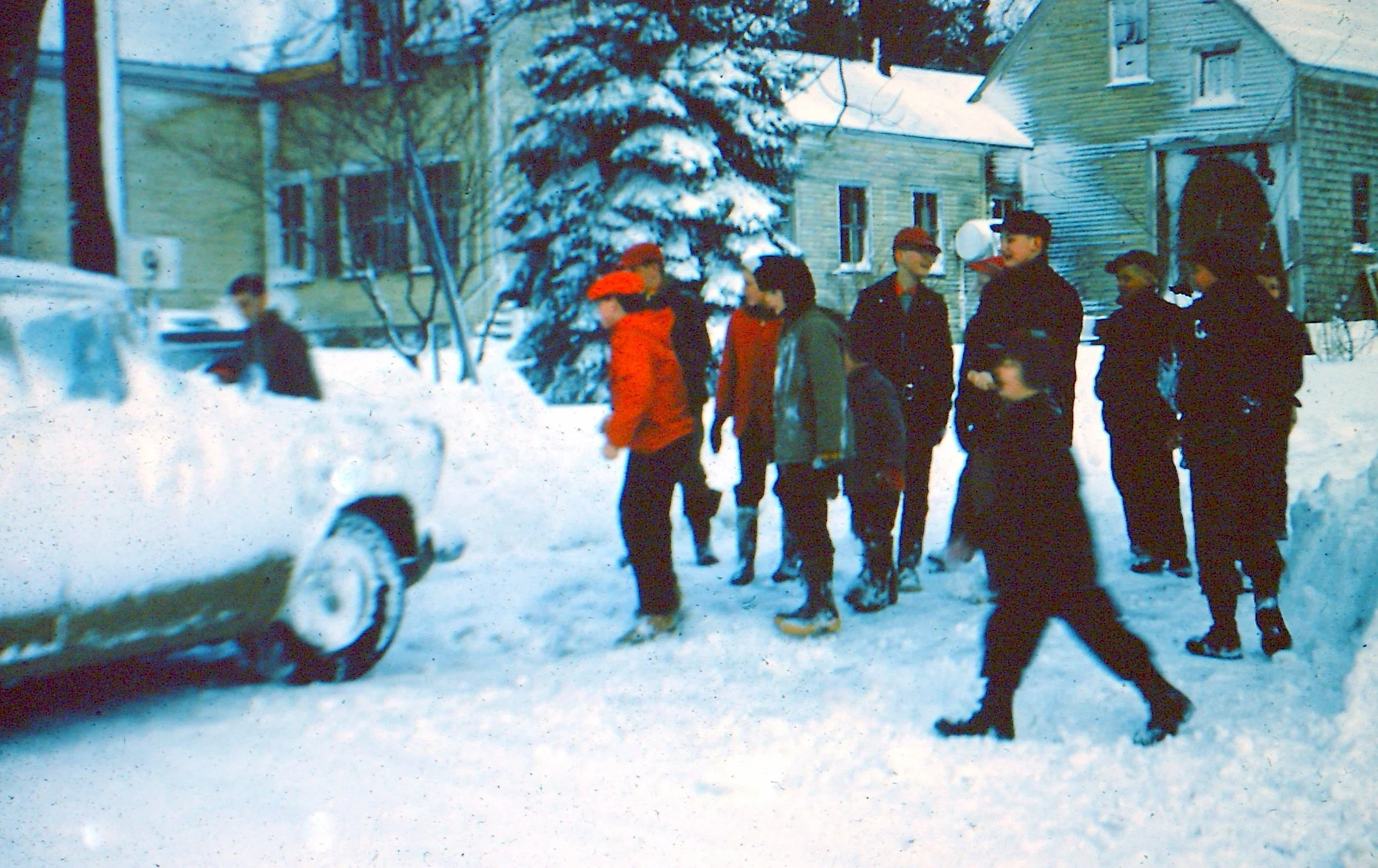 Helping Charlene Eliott out of snow 1961.JPG