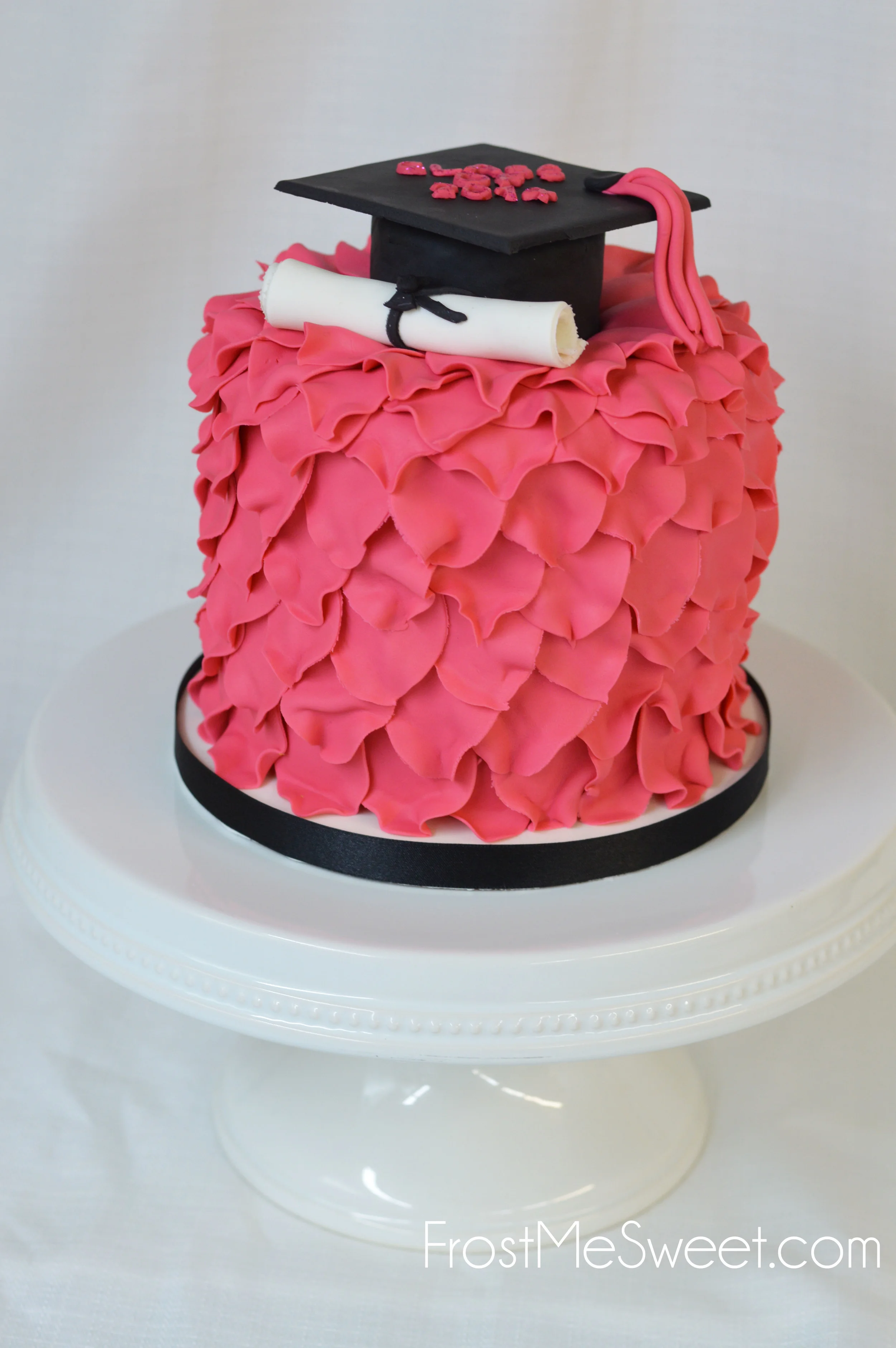 Pink flower petal graduation cake