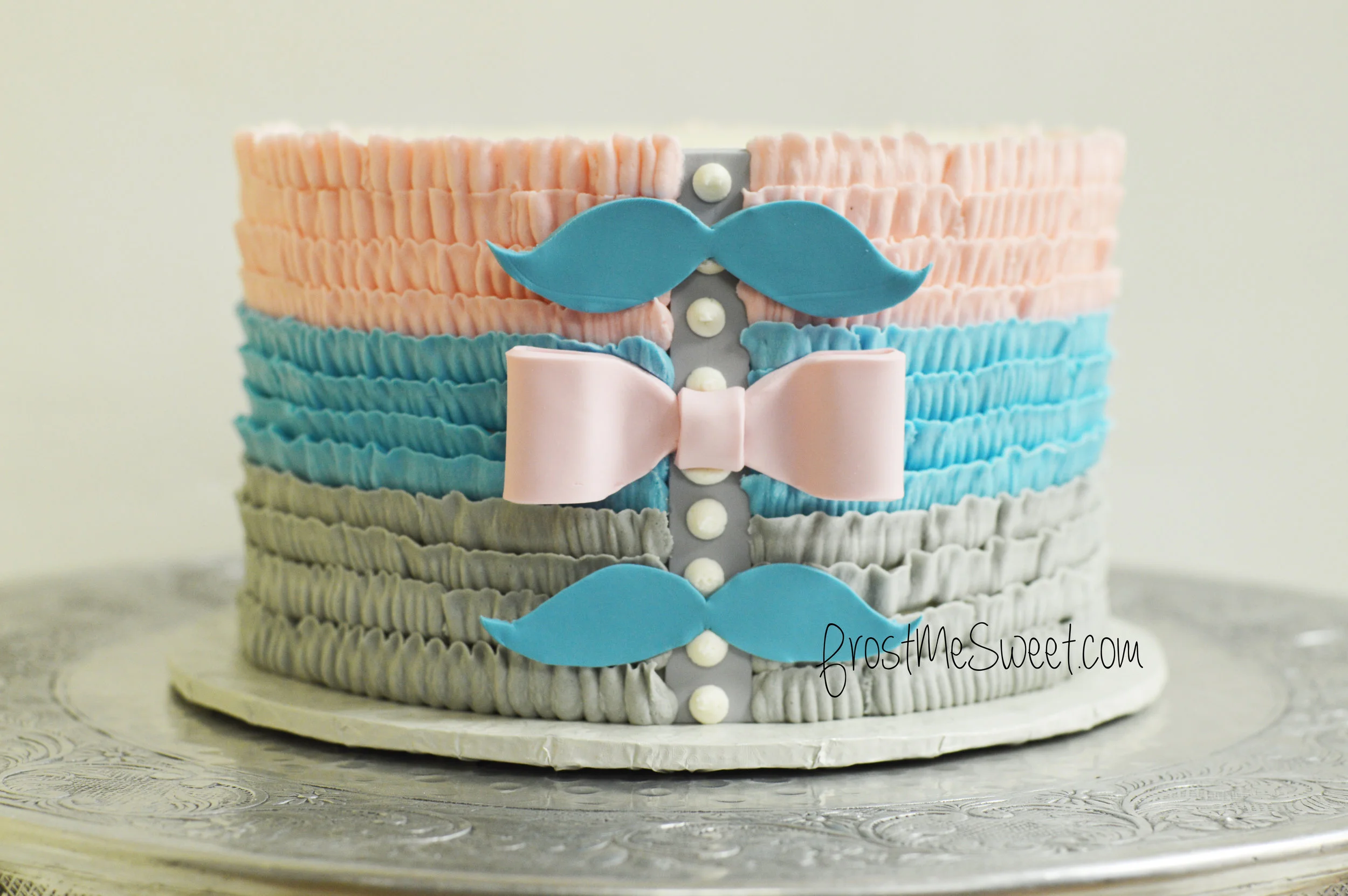mustaches and bows gender reveal cake.jpg