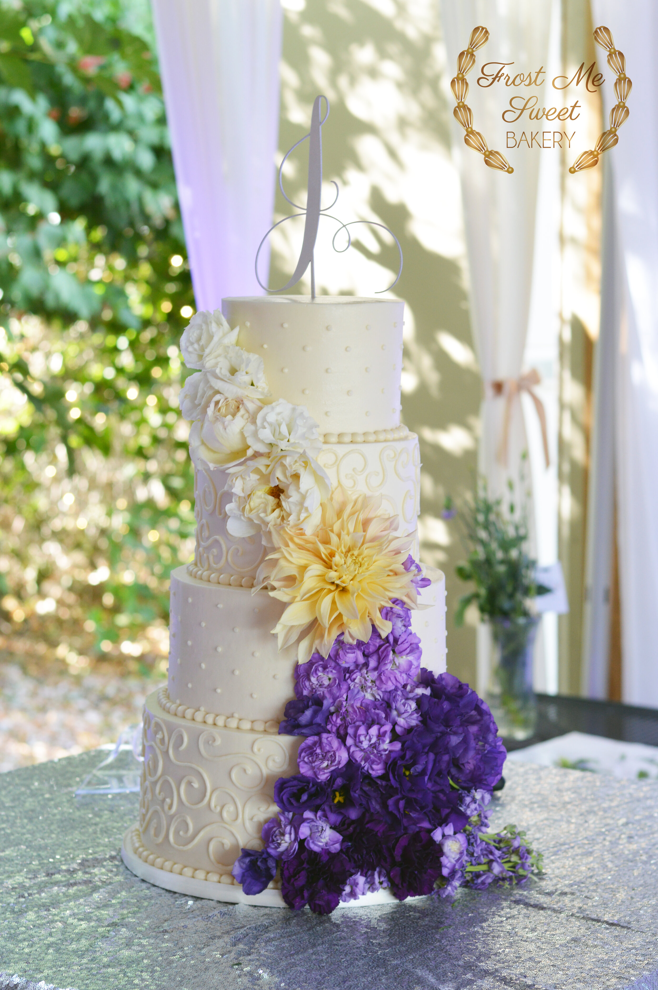ivory BC swiss dots with cascading flowers.jpg