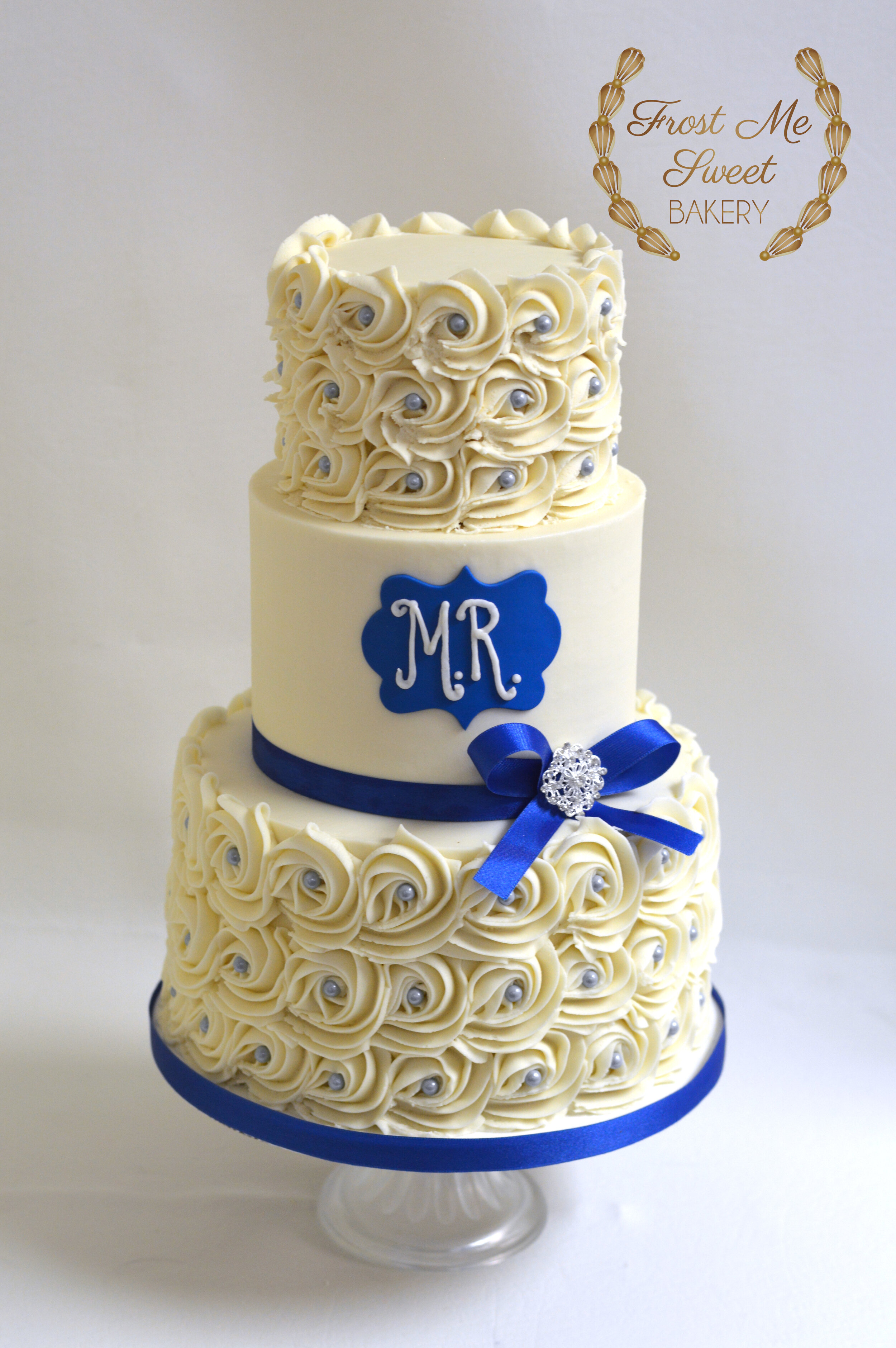 white rosette and royal blue monogram cake.jpg