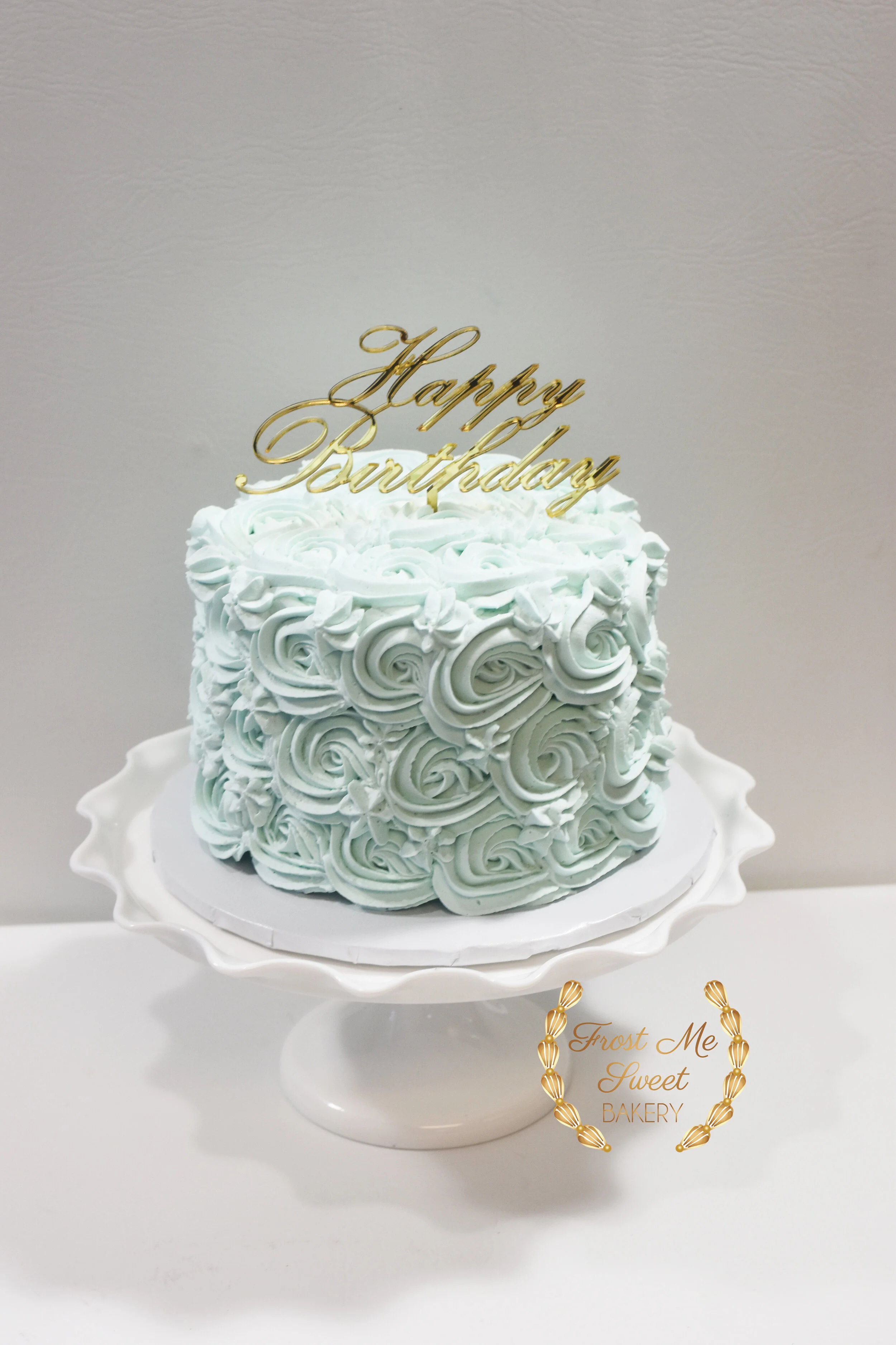 blue rosette with gold acrylic topper.jpg