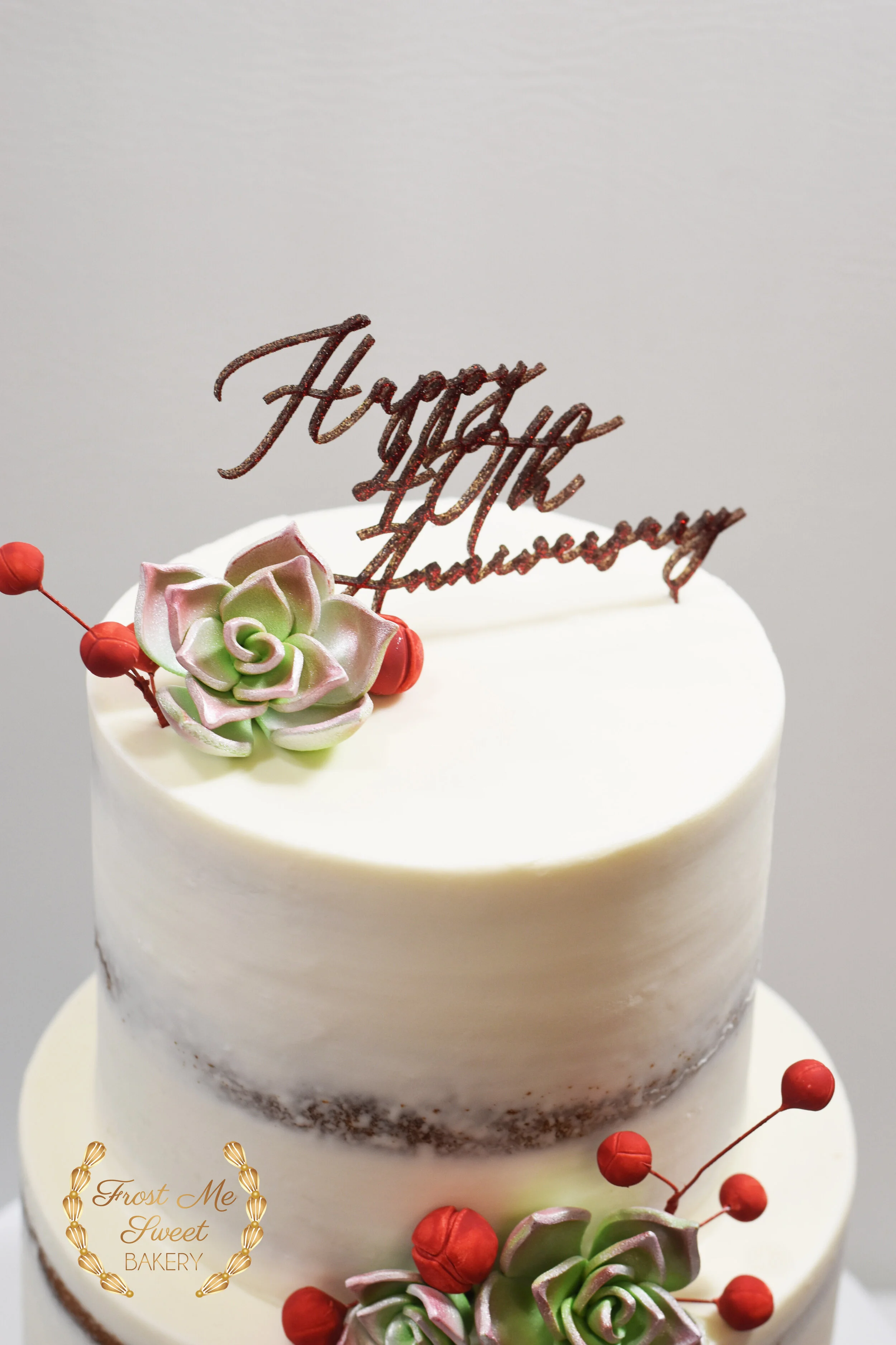 red berries and succulents anniversary cake topper.jpg