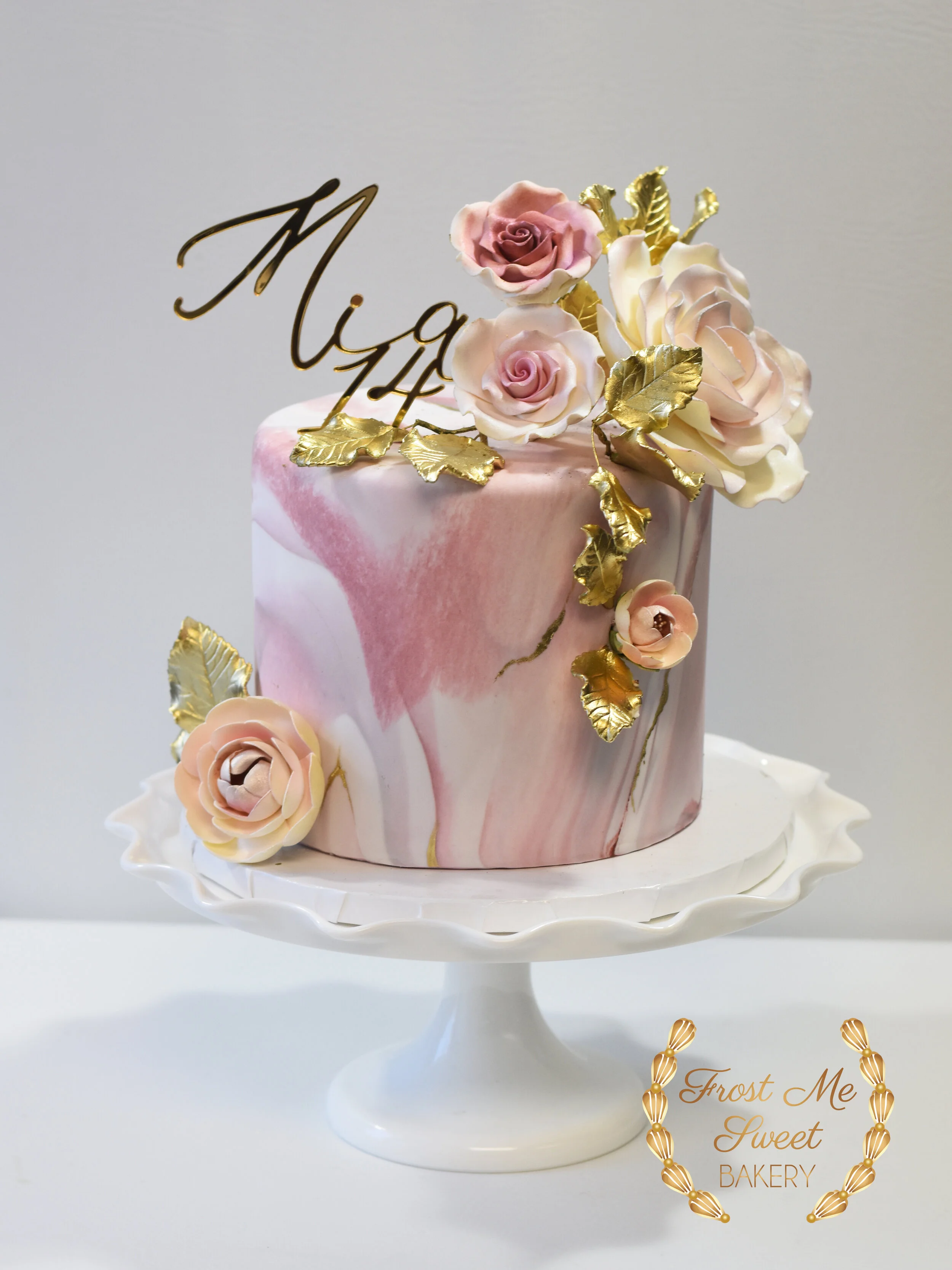 marbled pink with flowers and mirror gold topper.jpg