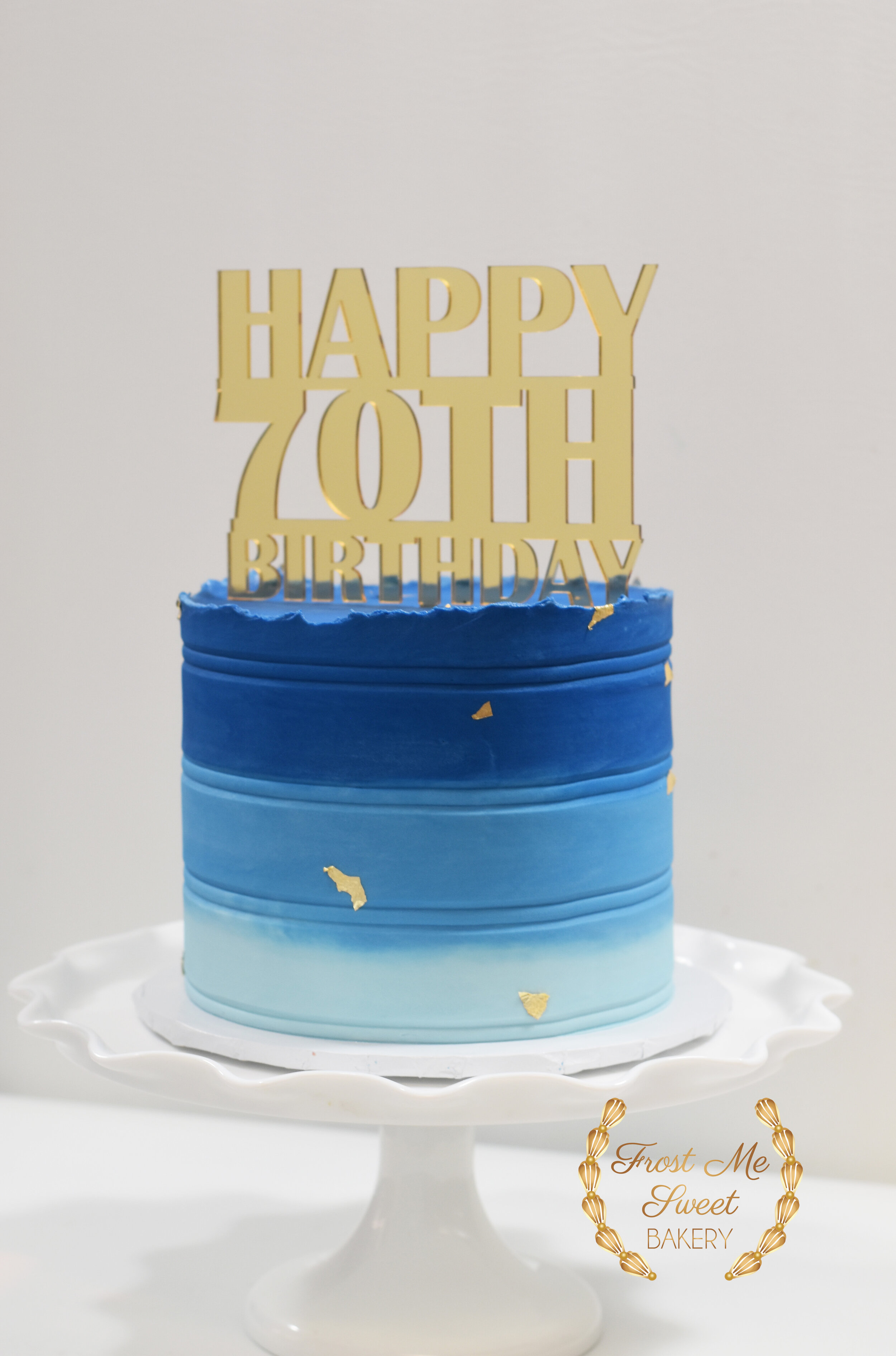 BLUE 70TH BIRTHDAY CAKE WITH GOLD ACRYLIC TOPPER.jpg