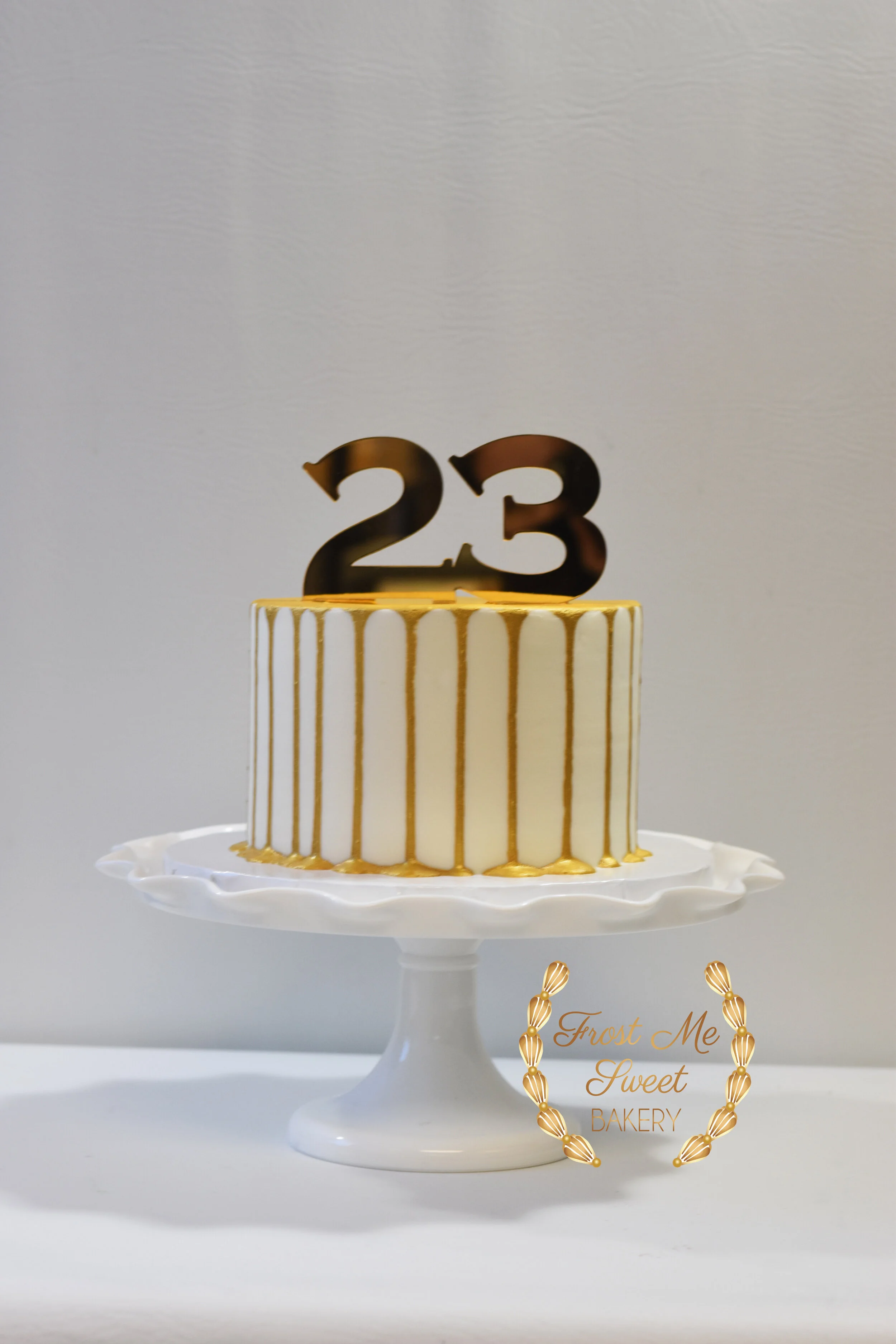 gold drip 23 topper cake.jpg