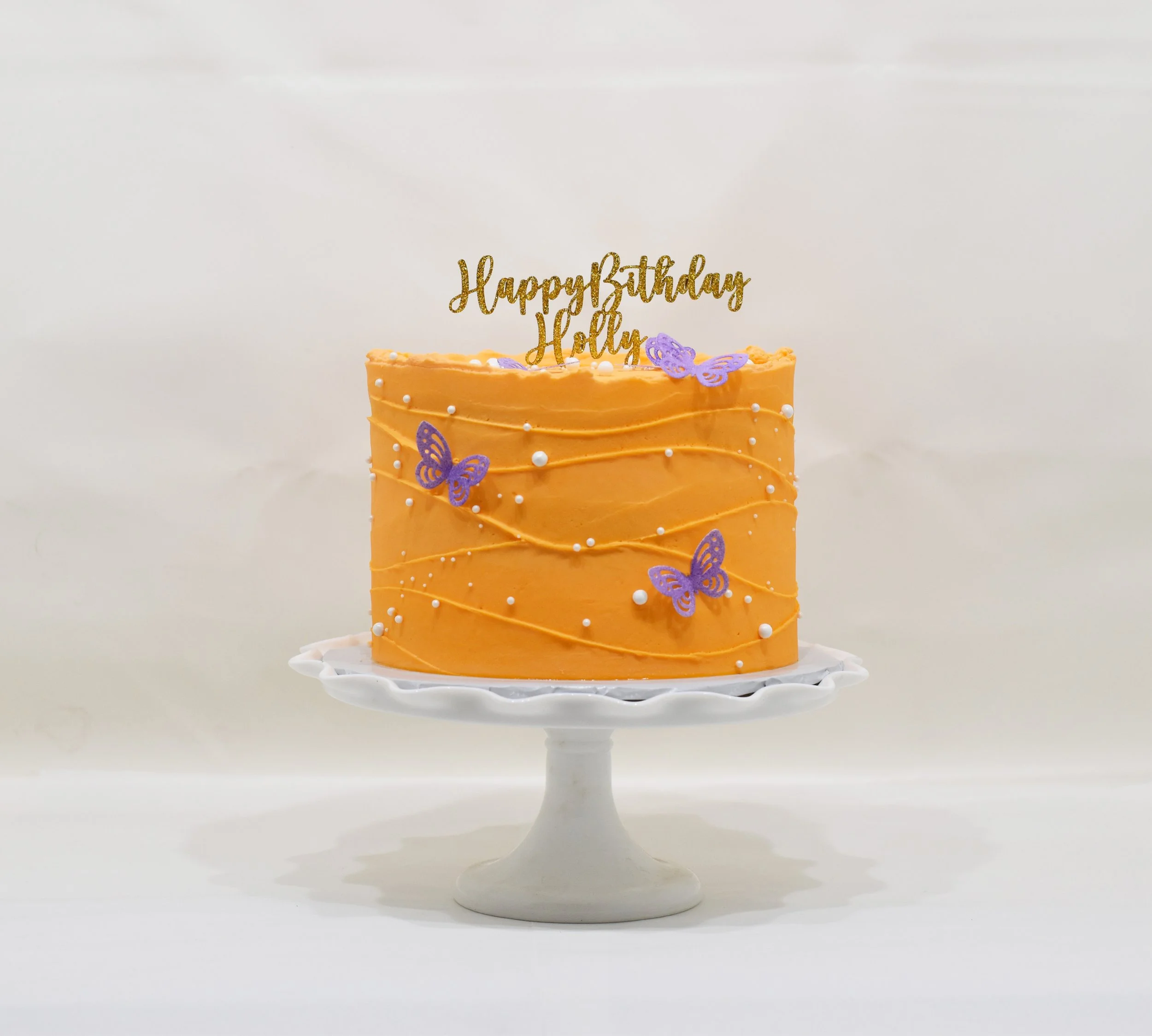 signature butterfly cake orange & purple with gold glitter acrylic topper.jpg
