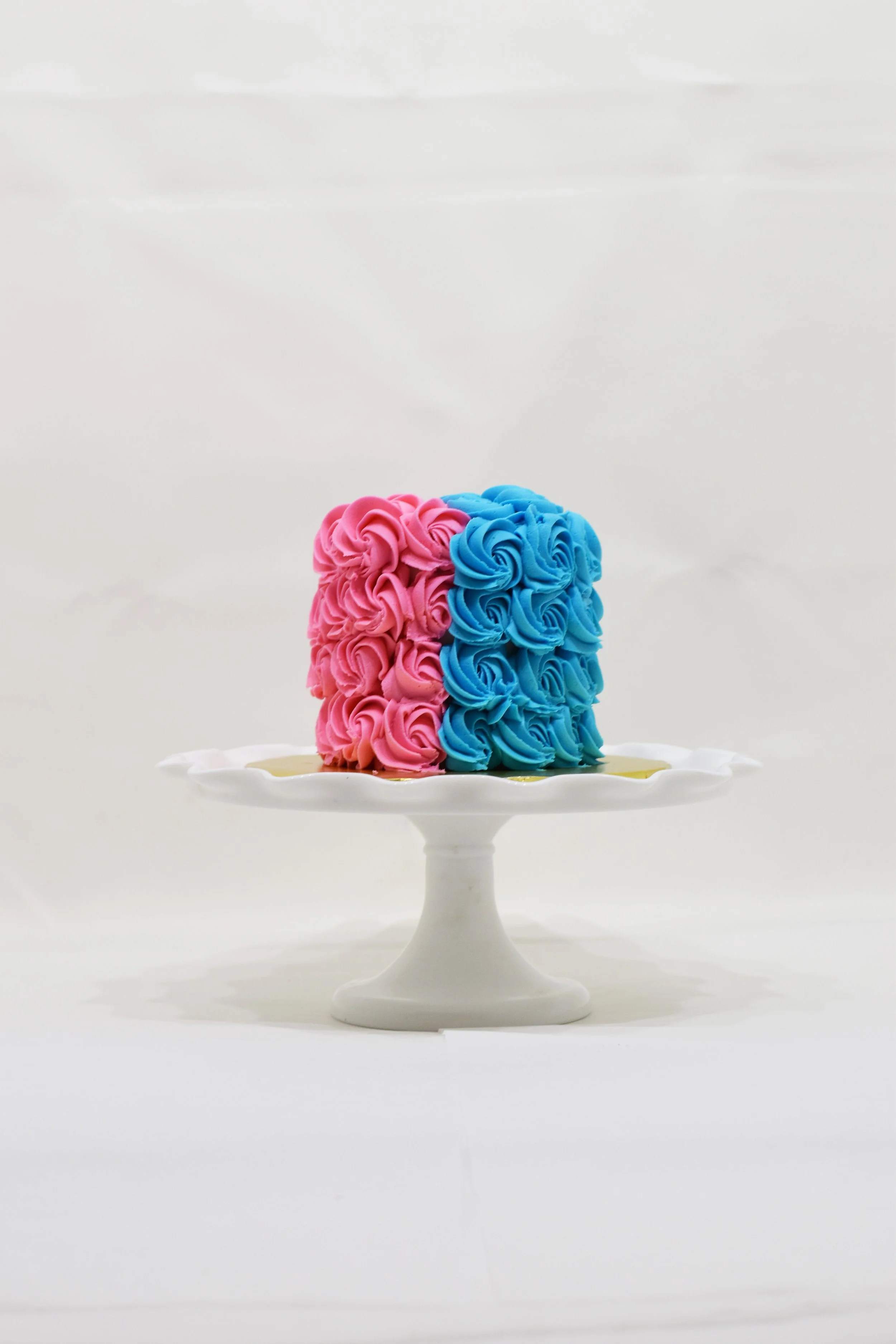 ROSETTE PINK & BLUE GENDER REVEAL CAKE.jpg