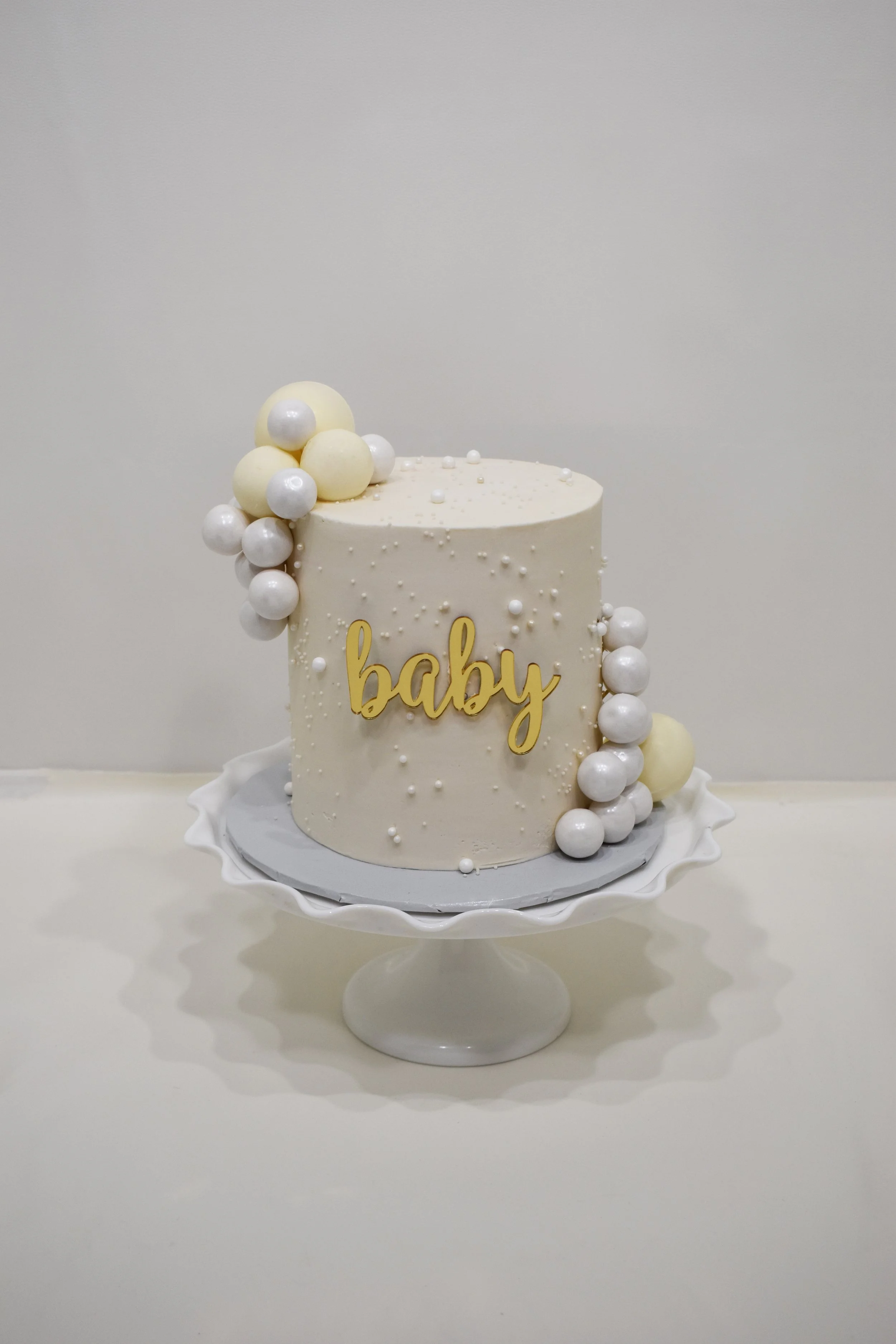 BABY SHOWER OR GENDER REVEAL CAKE ALL WHITE.jpg