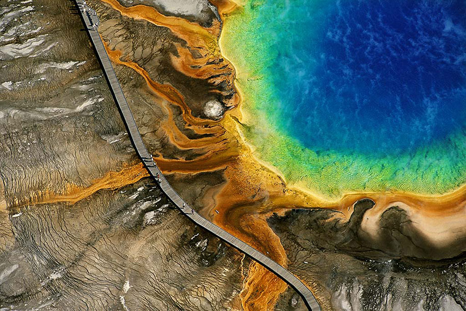 Yellowstone's Grand Prismatic Spring, Wyoming, USA The Grand Prismatic Spring is one of Yellowstone’s most popular attractions. The color is caused by bacteria that grow around the edge of the hot spring. ( via )