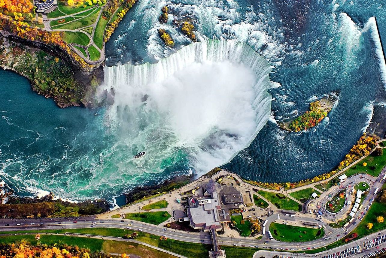 Niagara Falls Straddling the US-Canadian border, Niagara plunges over 165 vertical feet, which gives it the highest flow rate in the world.