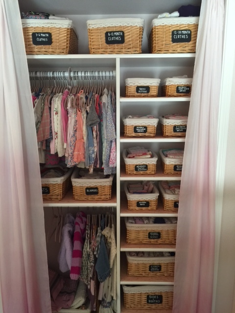 Using baby clothes hangers to organise a baby wardrobe