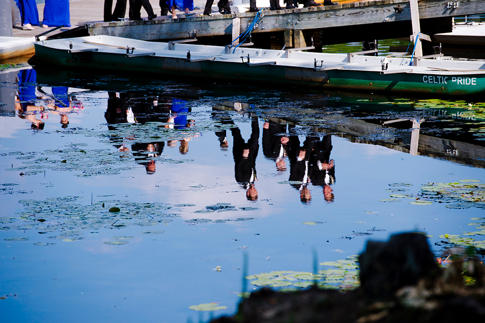Bridal party walks to ceremony at Harry Parker Boat House