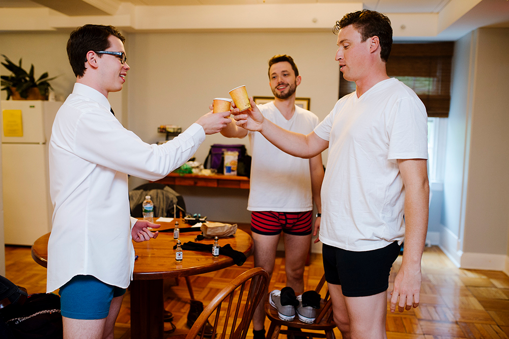 Groomsmen toast before wedding at The Connors Center, Dover