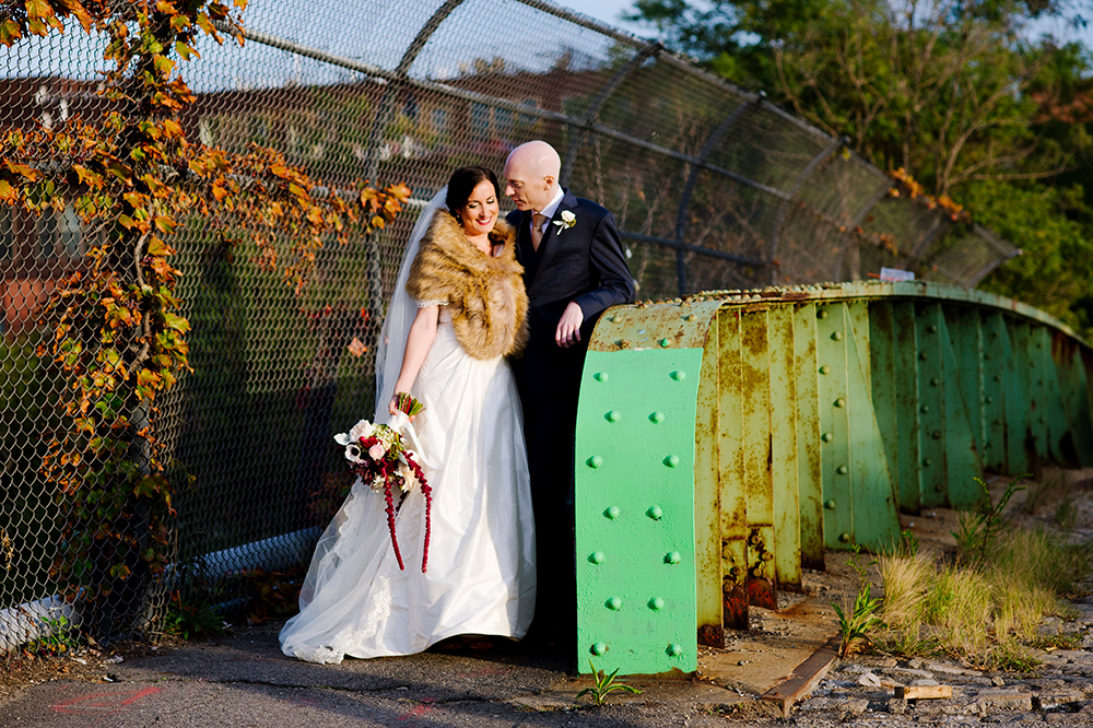 Bride and Groom pose for photo at Artists for Humanity, Boston