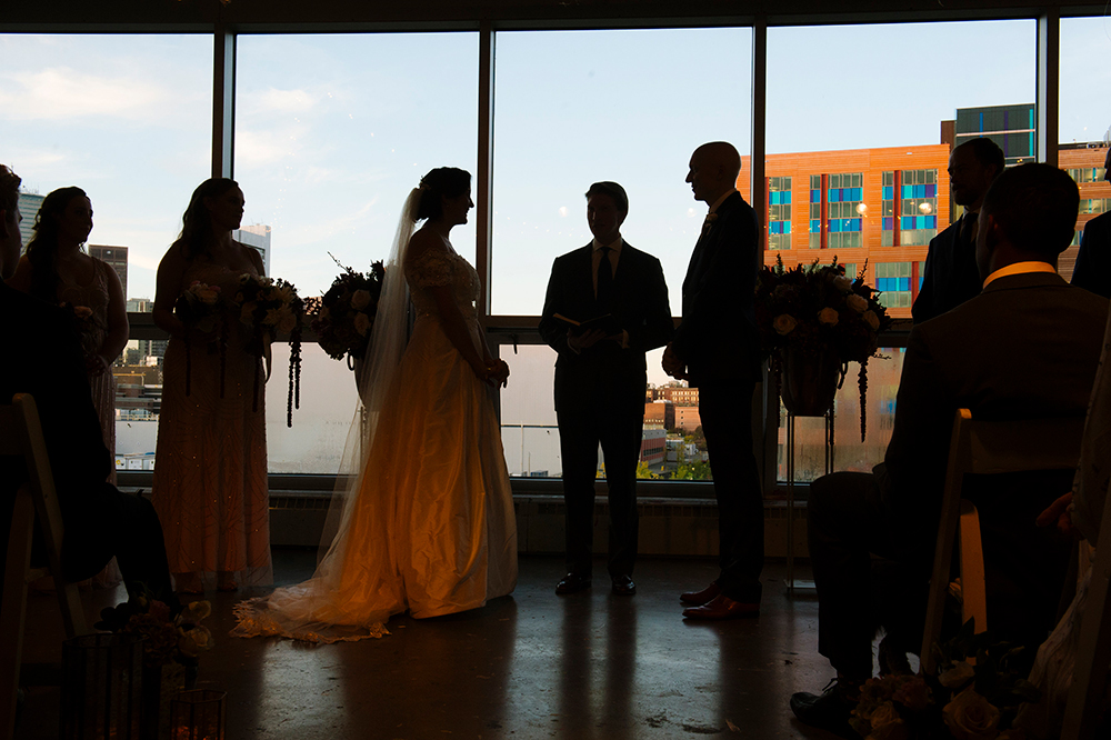 silhouette of bride and groom during ceremony at Artists for Humanity