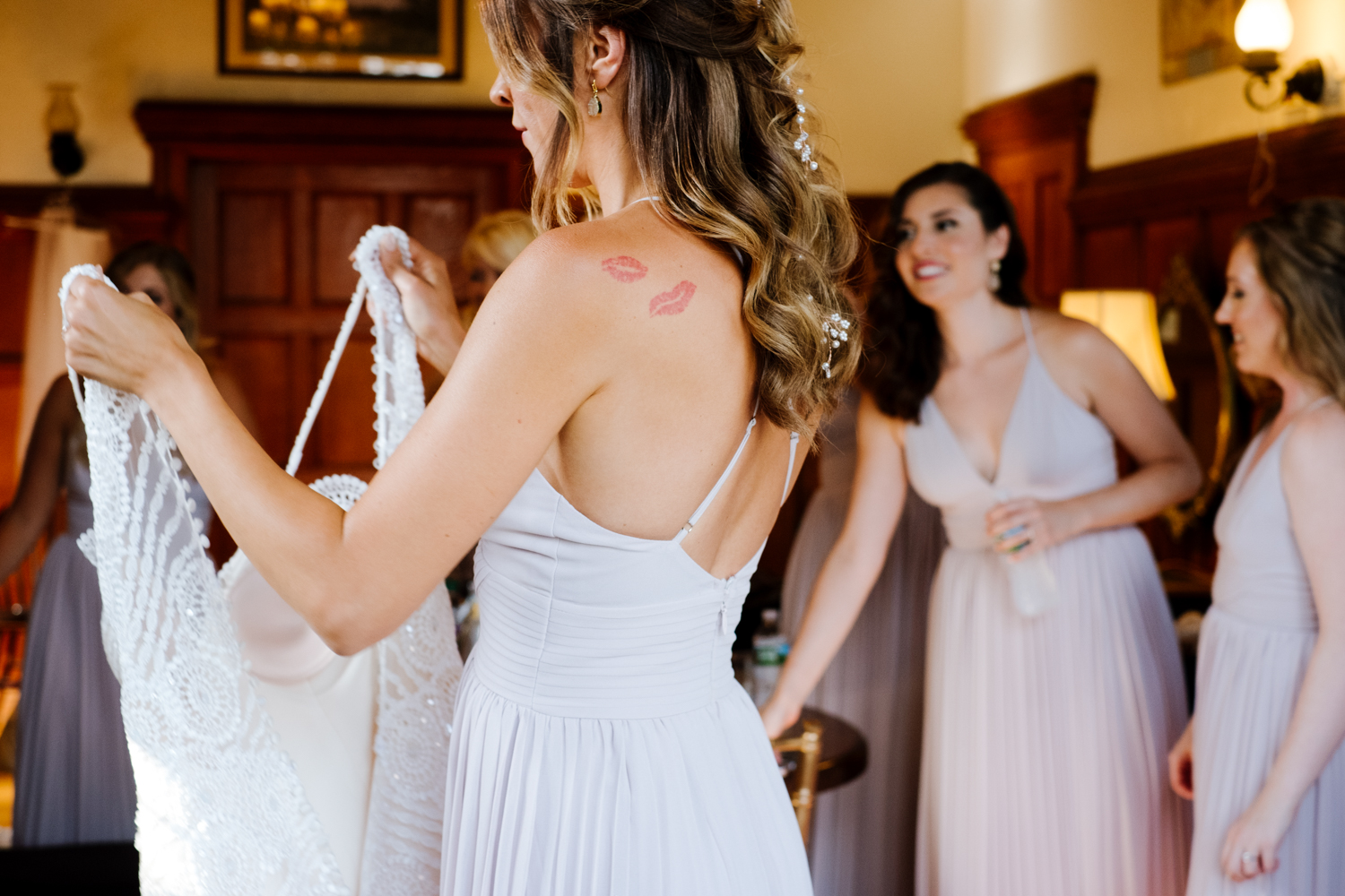 Maid of Honor gives Bride her dress