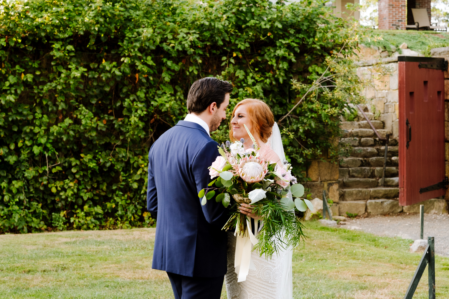 Bride and groom kiss during ceremony