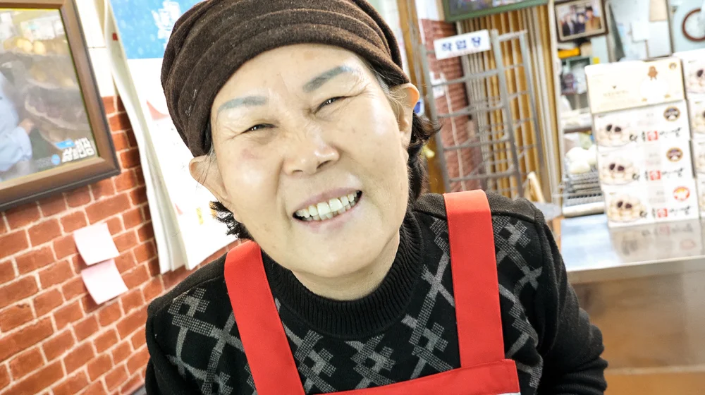 Friendly local who loaded us up with steamed buns. She was enthused to see foreigners and spoiled us with her tender loving care :)