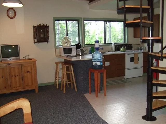 Kitchen with lots of sunlight, pots, pan, and utensils for creating your after-hike feast.