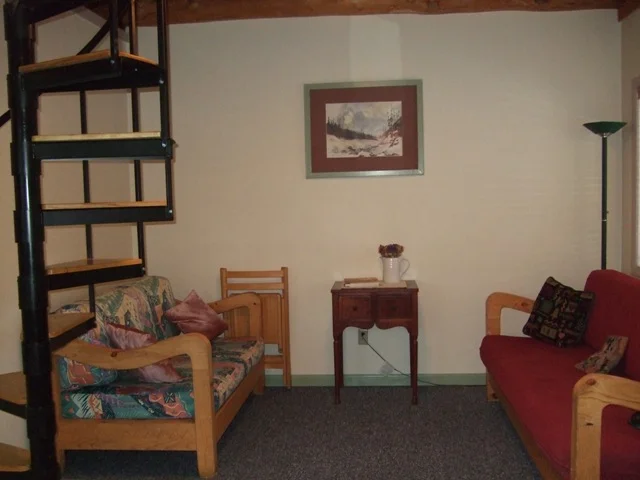 Comfy couches for relaxing in the Cozy Cabin. 406-226-9227.