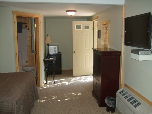 Room 9 is shaded, has two queen beds, air conditioning and a flat screen television as well as a refrigerator, microwave, coffee maker and free wifi.