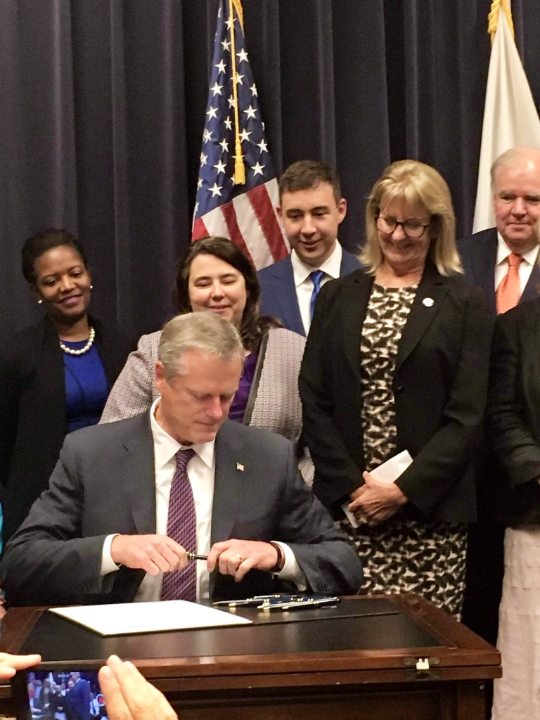 Governor Baker signing the Pregnant Workers Fairness Act in July 2017