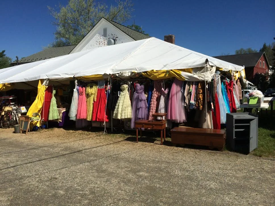 A tent full of vintage clothing