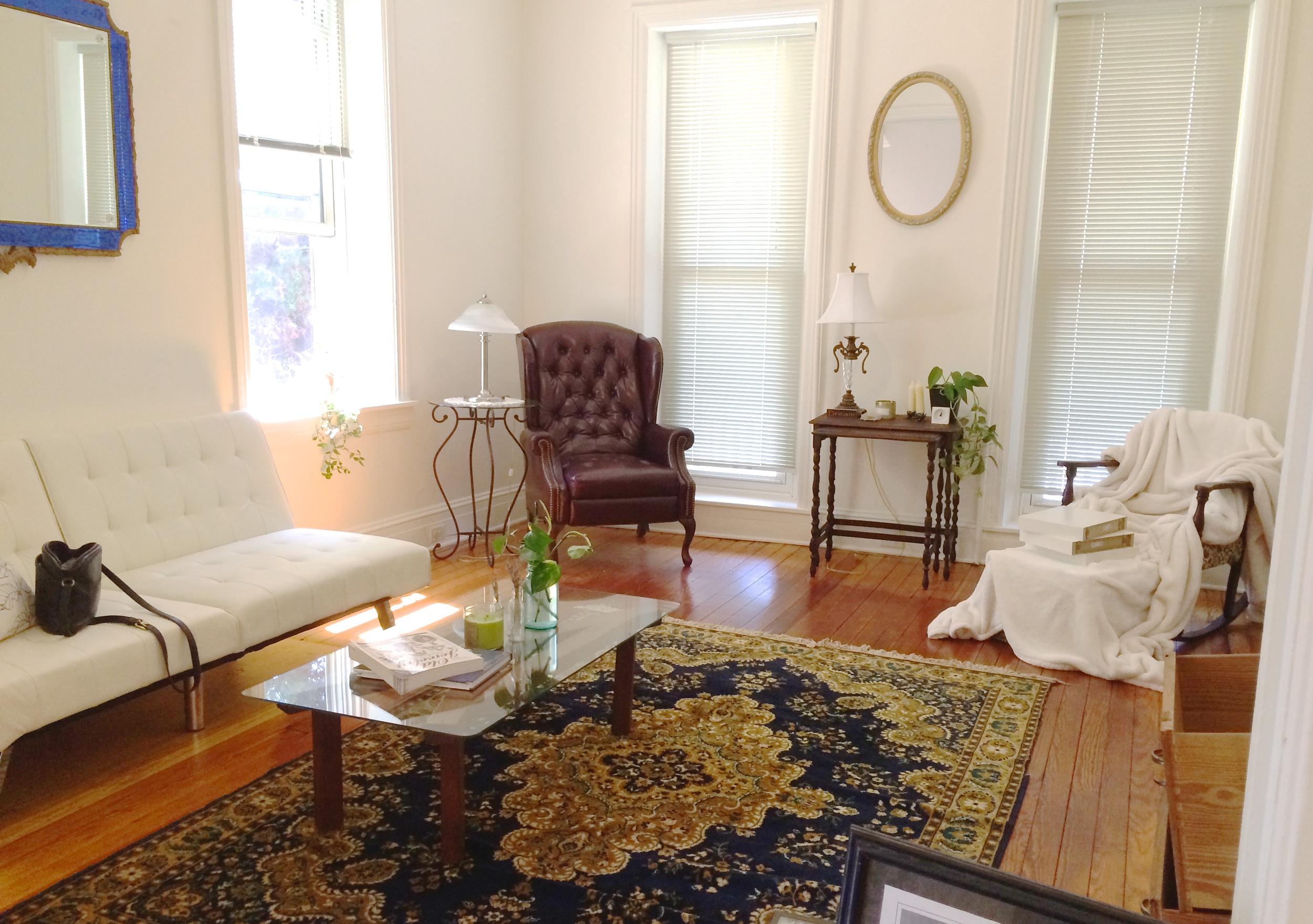 Living room, featuring: vintage rug & mirrors from auction
