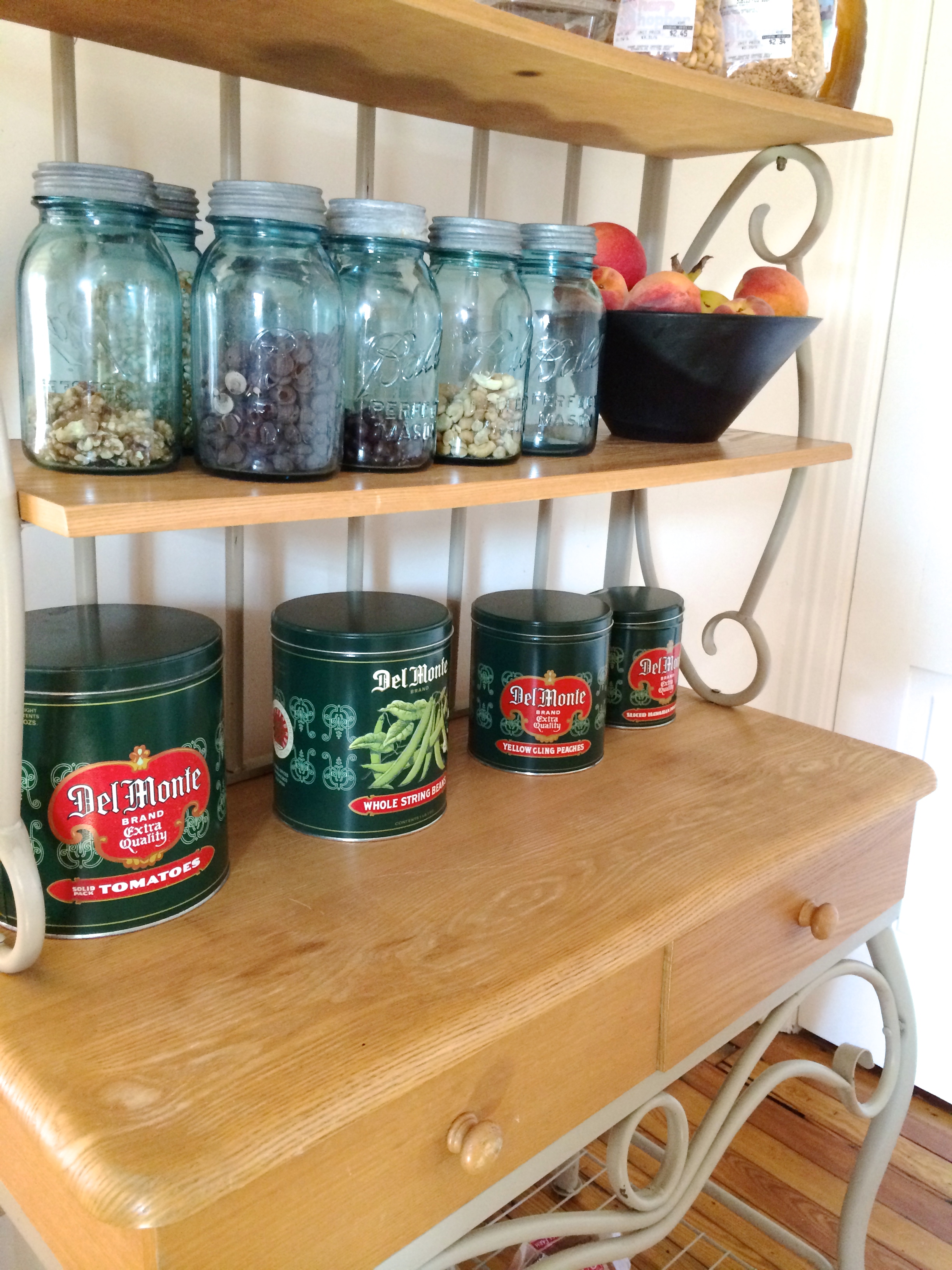 Bakers Rack with vintage Ball jars & tins