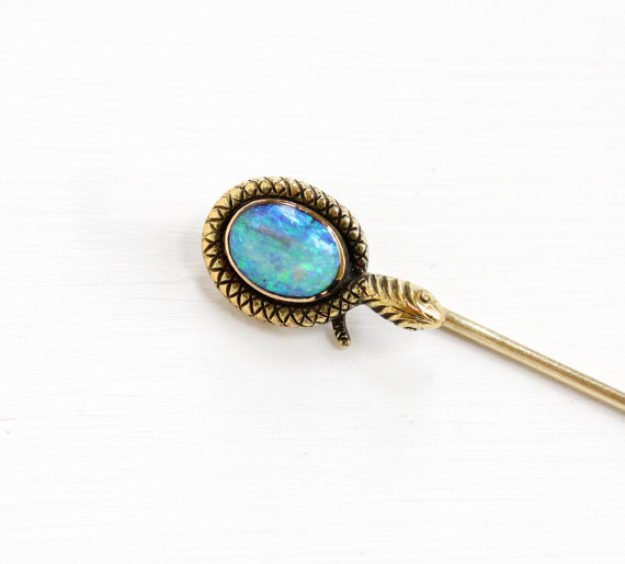 Stunning fiery Opal & Snake Stick Pin. Opals signified protection, loyalty & faithfulness.