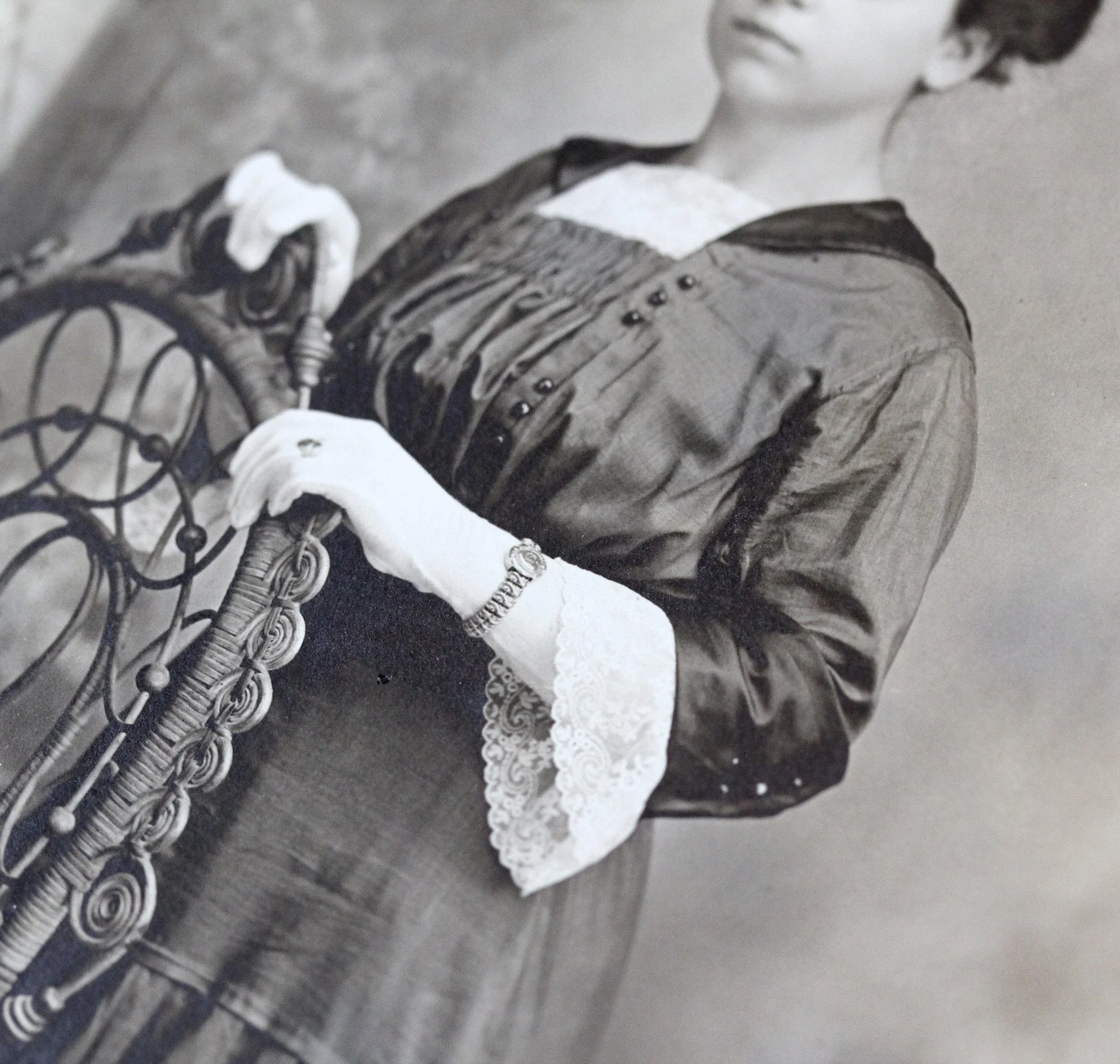 In addition to her expansion bracelet she is seen wearing a filigree ring on her gloved hand.