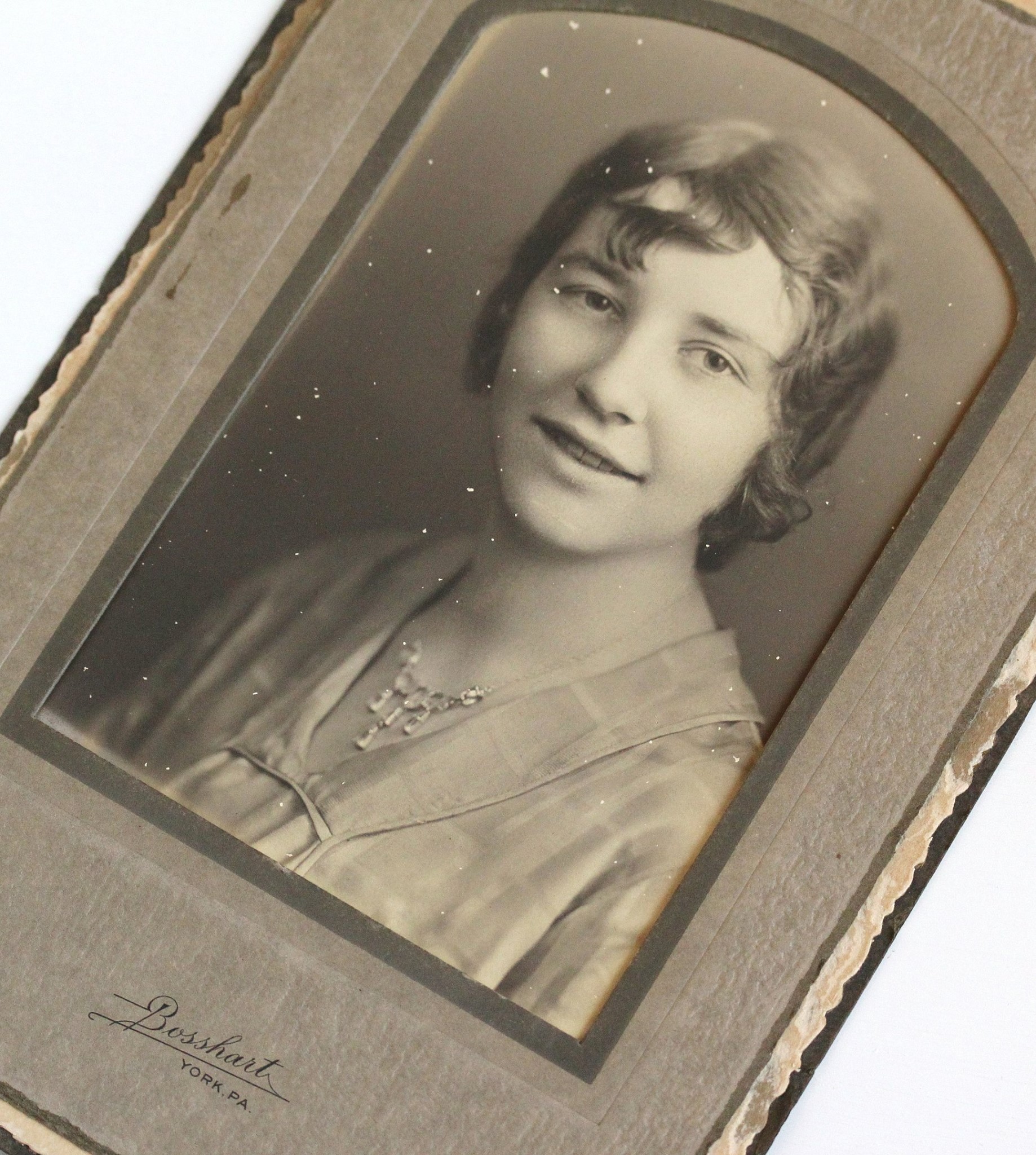 Art Deco era photograph from York, Pennsylvania of a stylish young lady proudly wearing a gorgeous open back glass waterfall necklace.