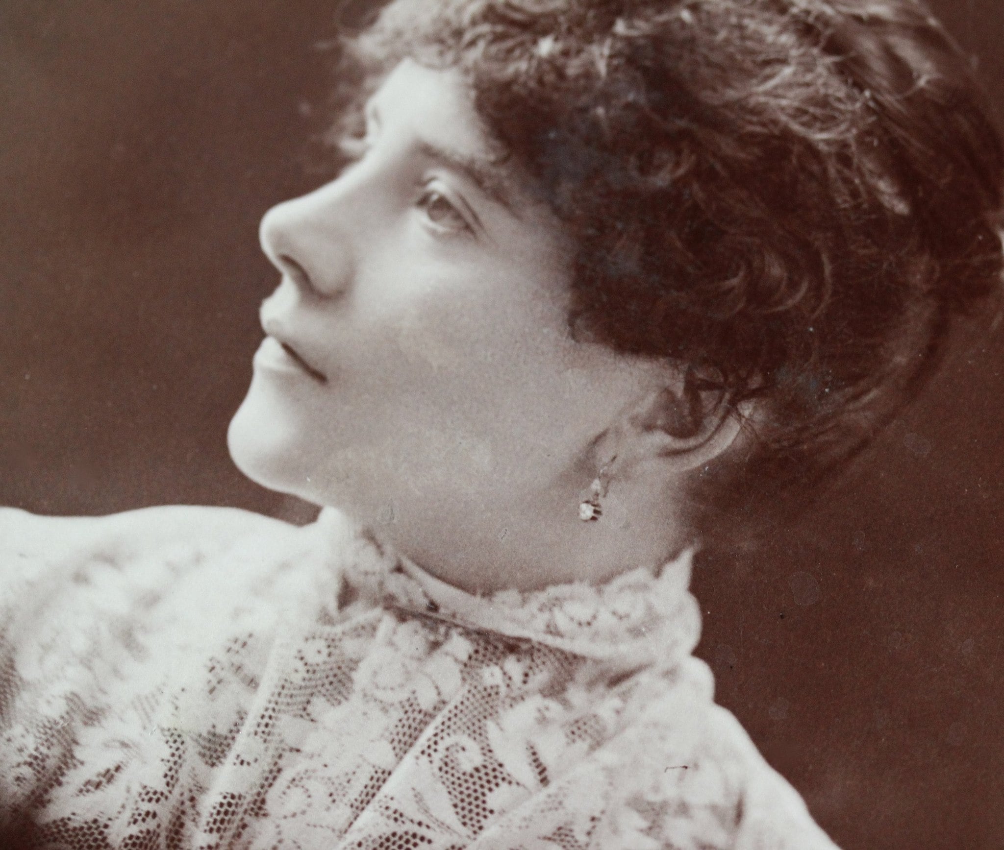 Victorian era cabinet card from Lewiston, Maine featuring a gorgeous lady wearing beautiful paste (or diamond?) earrings.