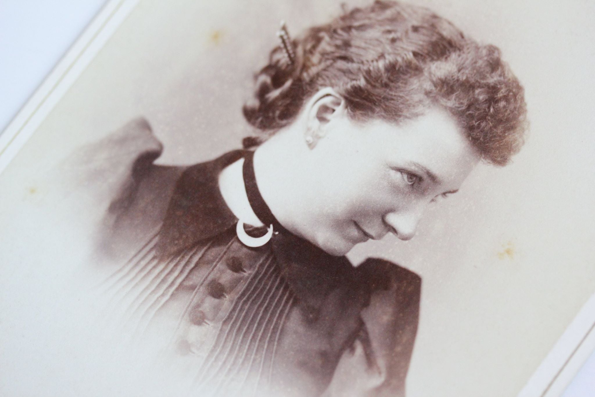 Last but not least we have our cheeky young lady wearing a magical crescent moon brooch. This is a Victorian era cabinet card from Boston, Massachusetts. 