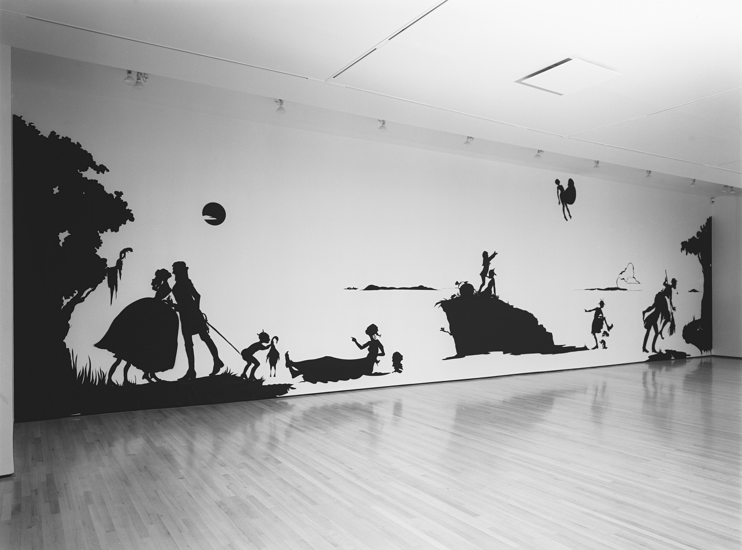  Kara Walker,&nbsp; Gone, An Historical Romance of a Civil War as it Occurred between the Dusky Thighs of One Young Negress and Her Heart , 1994. Cut paper on wall, approx. 156 x 600 inches.&nbsp;The Drawing Center, New York, 1994. Photo: Orcutt Phot