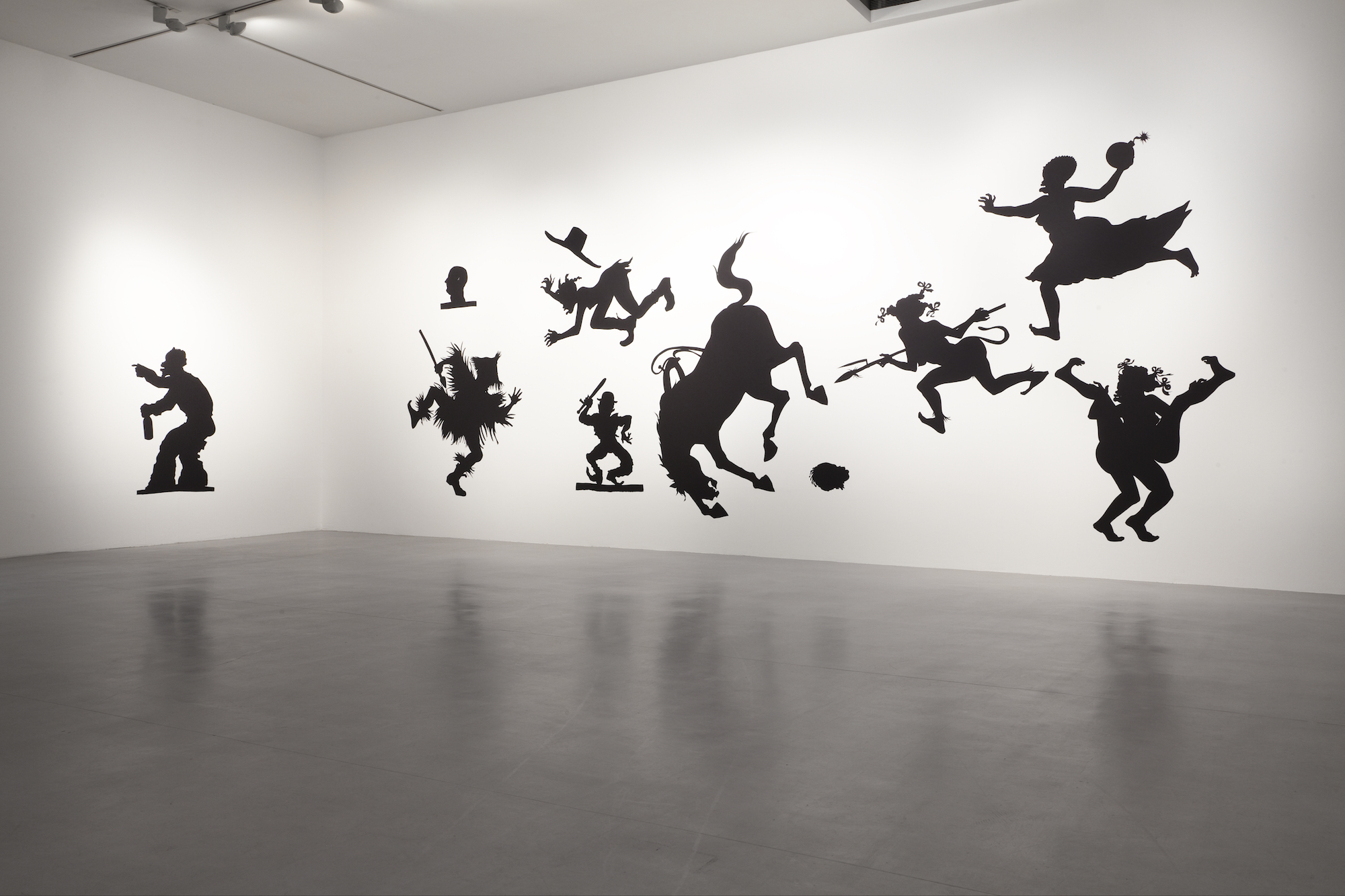  Kara Walker,&nbsp; Auntie Walker's Wall Sampler for Savages , 2013. Cut paper on wall, approx. 132 x 408 inches.&nbsp;Camden Arts Centre, London, 2013. Photo: Angus Mill Photography 