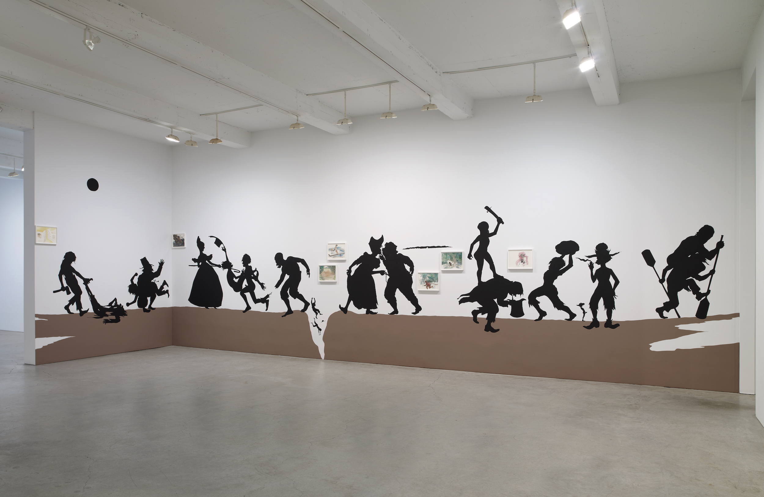  Kara Walker,&nbsp; The Nigger Huck Finn Pursues Happiness Beyond the Narrow Constraints of your Overdetermined Thesis on Freedom - Drawn and Quartered by Mister Kara Walkerberry, with Condolences to The Authors , 2010. Cut paper and paint on wall; g