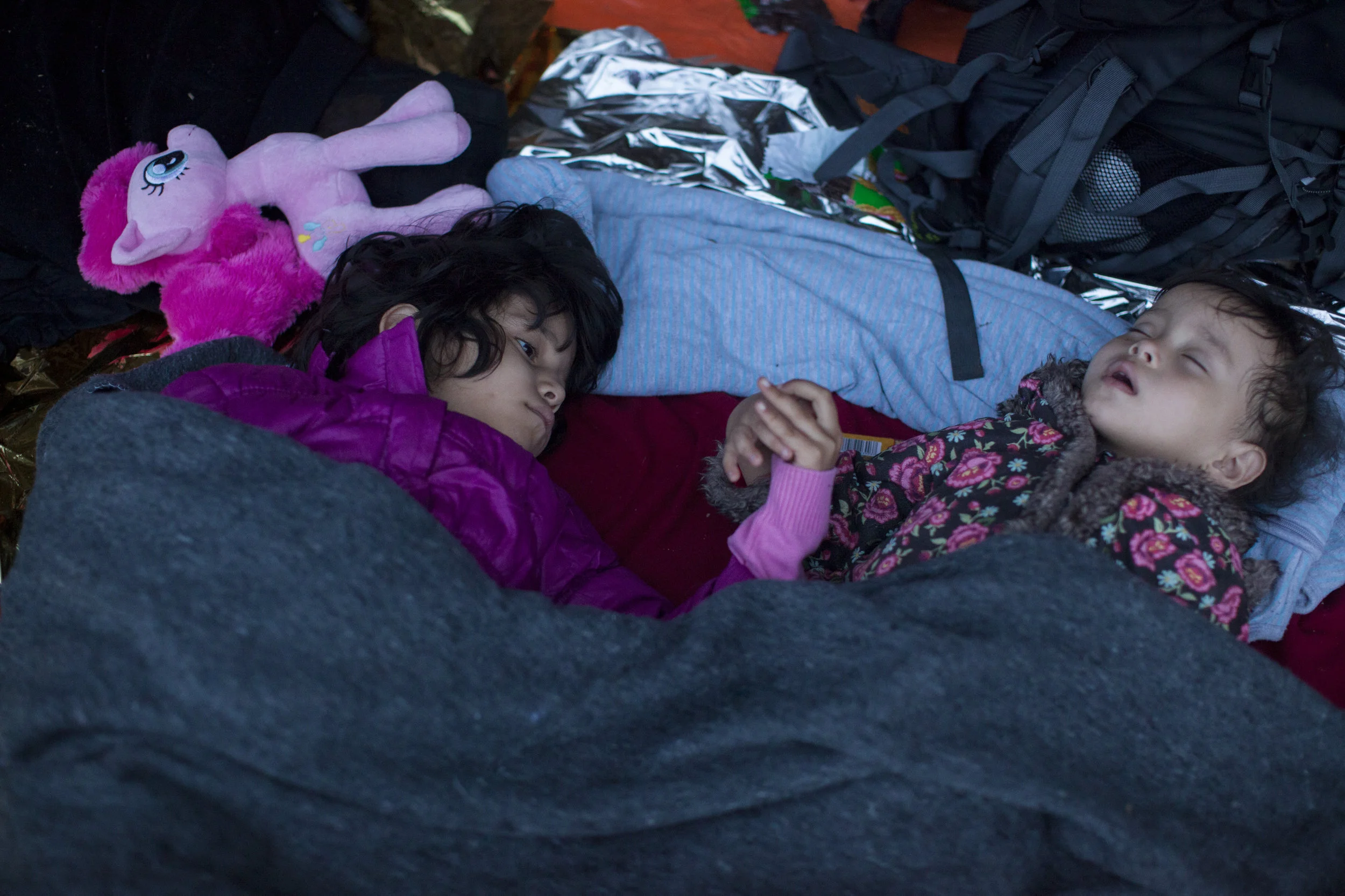 Who is the Refugee_ Refugees sleep while waiting for daylight after arrival on the Greek island of Lesbos. Photo by Ron Haviv.jpeg
