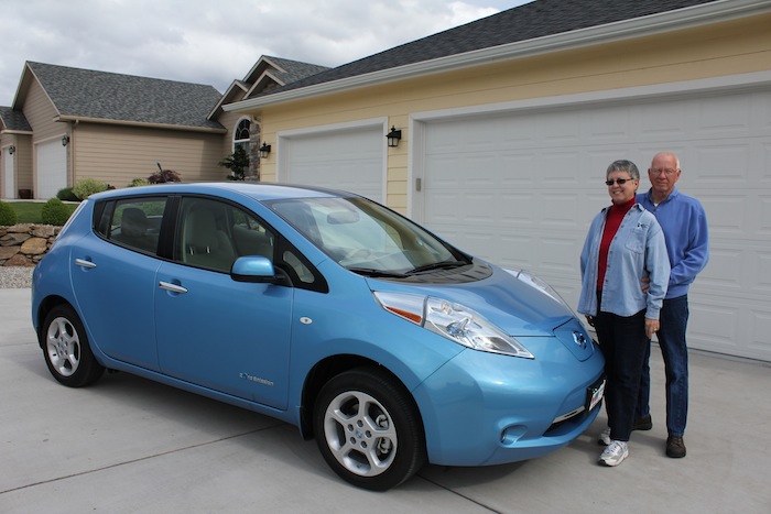 Pauline and John Sweeney with their all-electric Nissan Leaf.