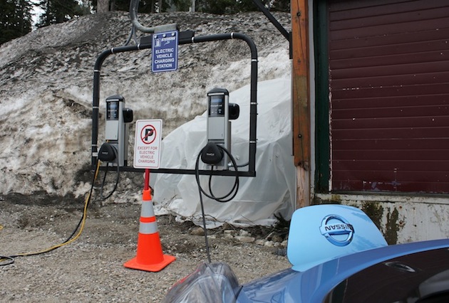 An all-electric Nissan LEAF charges up at the first charging stations to be installed over a mountain pass in the United States.